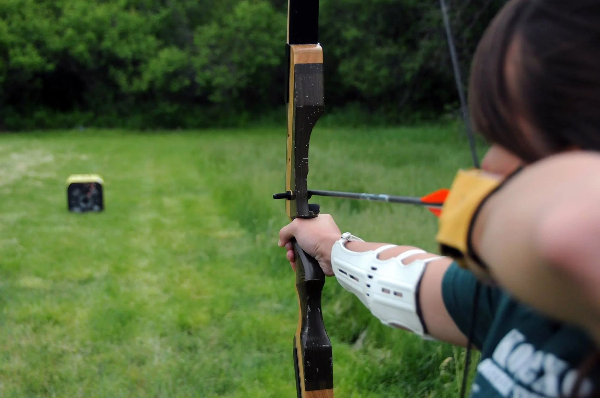 Andrea enjoys archery during field school in 2015, an annual event she hosted with Michael. Other activities included hiking, swimming, and rock climbing.