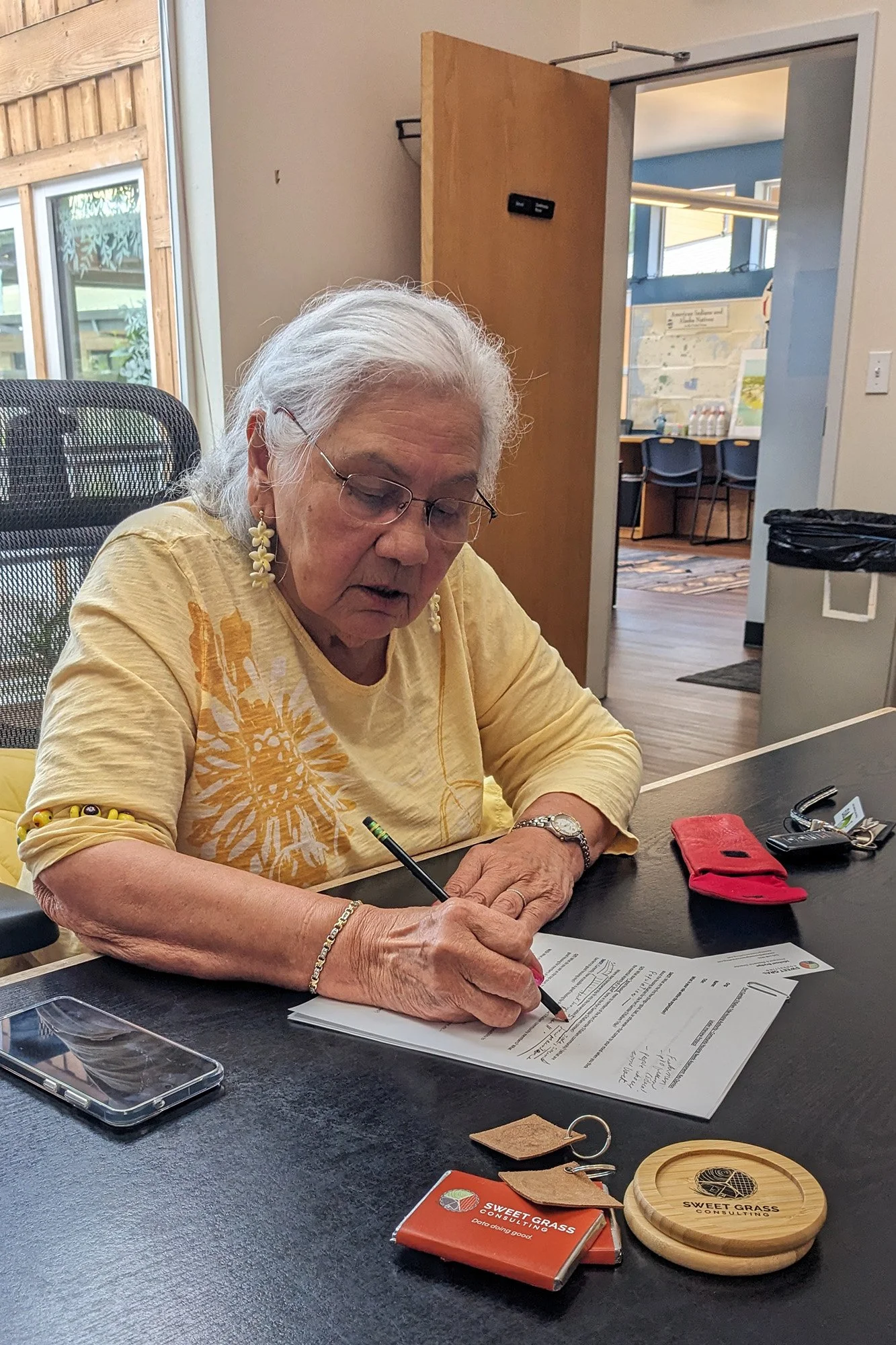 Port Gamble S’Klallam elder filling out the community housing survey.