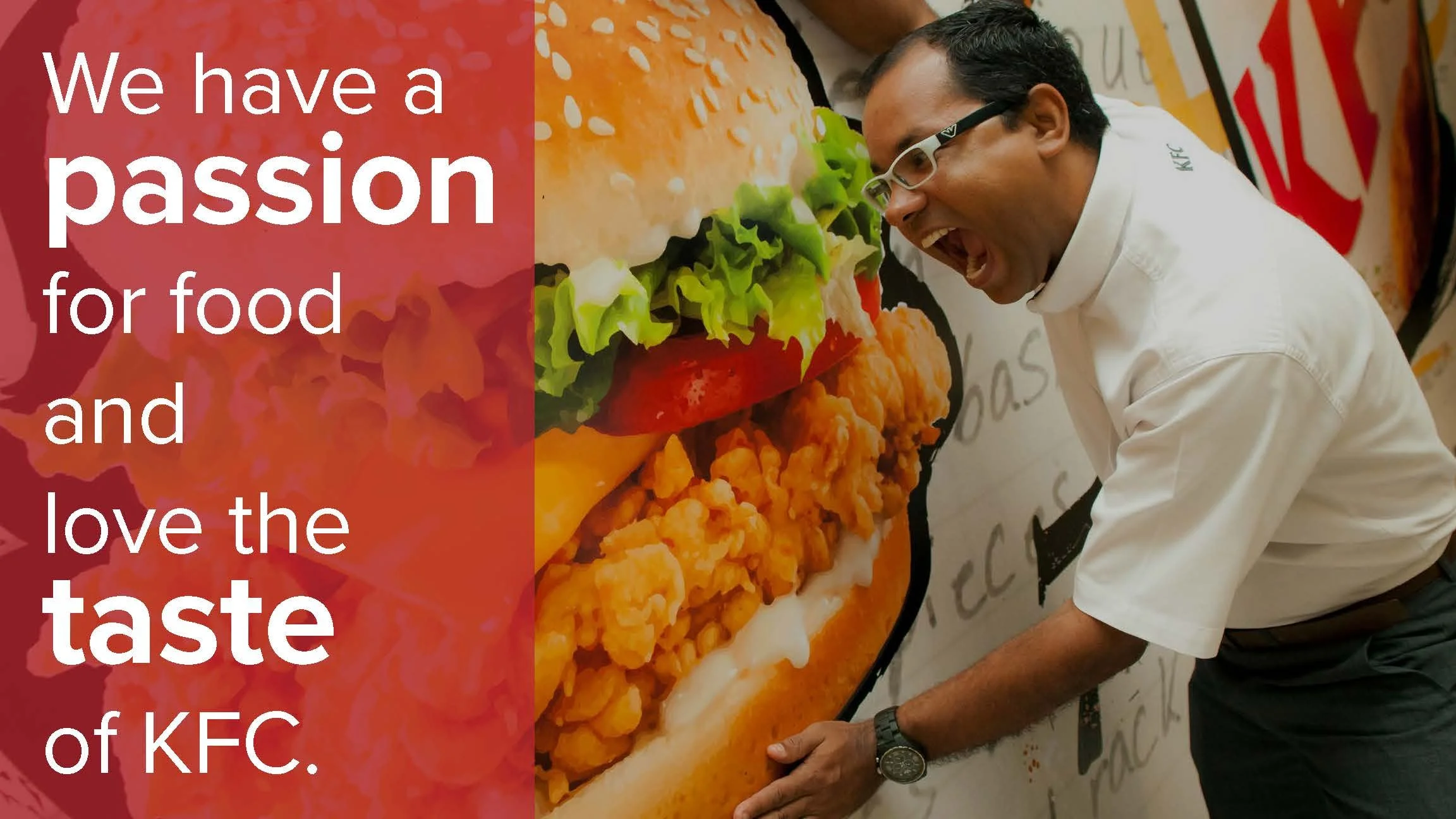 A man is pretending to bite into a large KFC chicken sandwich, with a background of a KFC advertisement. Overlaid text reads, 'We have a passion for food and love the taste of KFC.'