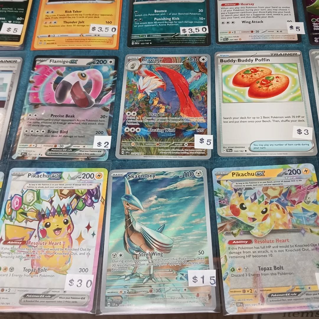 The Pok&eacute;mon case is filled up with cards fresh from Surging Sparks. Gotta catch them all! #lgs #Pok&eacute;mon #pikachu #surgingsparks #pokemongo #pokemontcg
