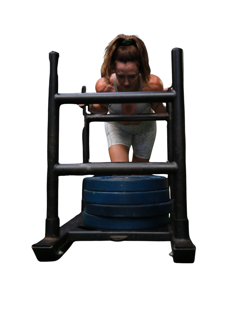 Athlete pushing a sled at LFG Training