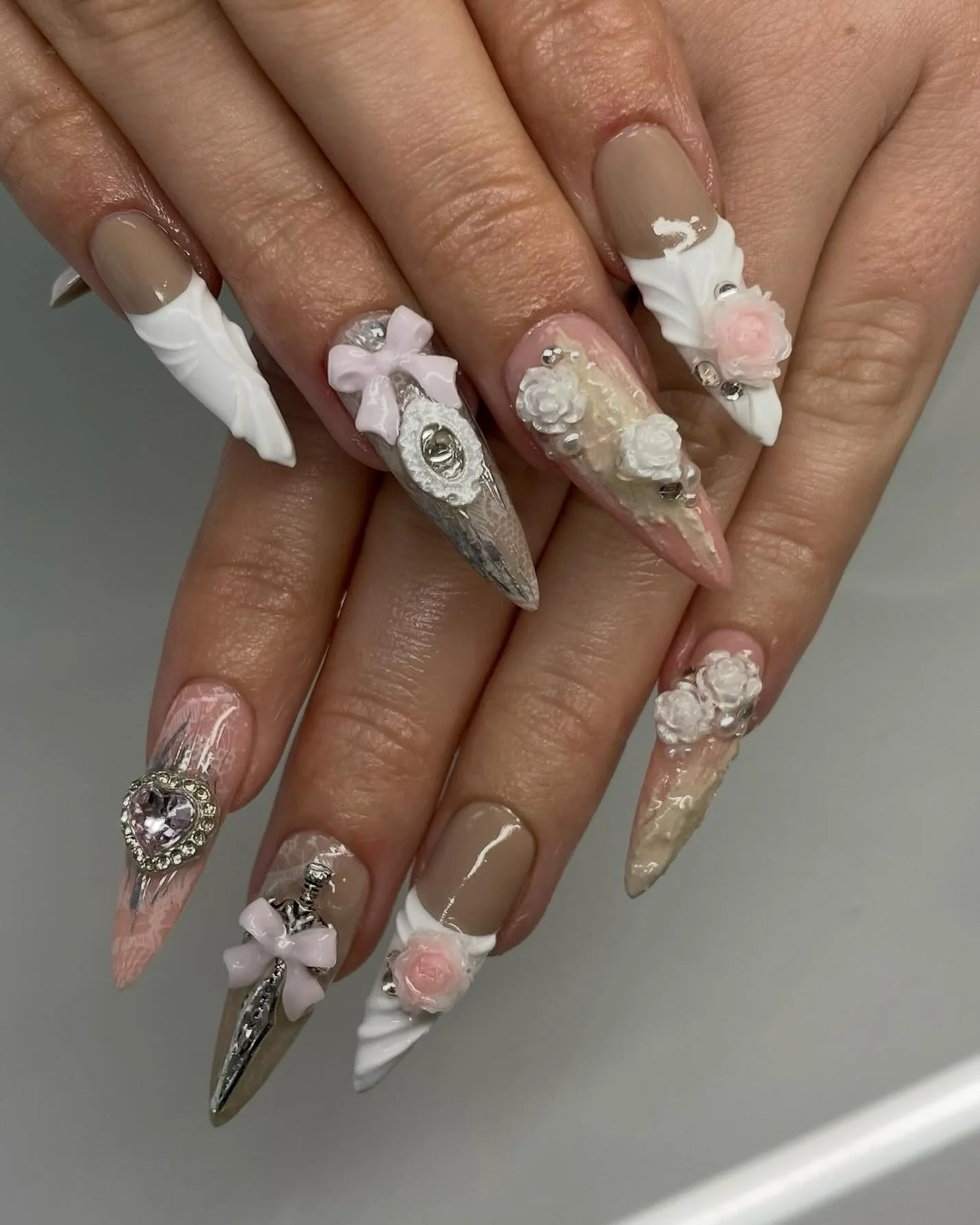 Advanced - 🎀 Silver, Lace and Rose 🗡️
Credit to @mehnail.vn for the inspo 💘 
Used @functionofvex fine print in Bone and grit gel in Sand 🦴
#gelx #gelnails #nailart #nailinspo #coquette