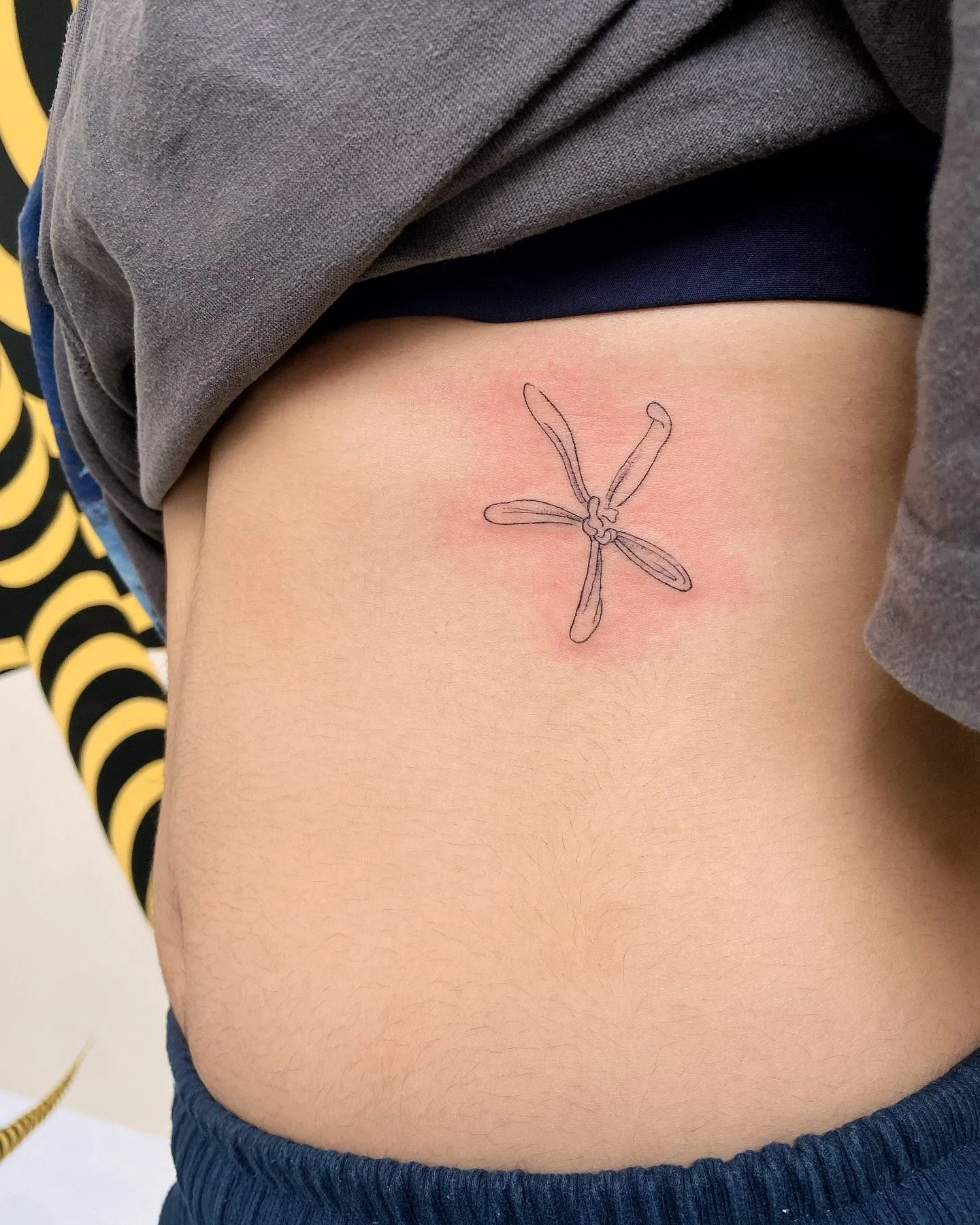Your first tattoo 🌸 my last tattoo (of 2025)
.
Thank you so much! For your trust, Jayne 🤲🏽&hearts;️ twas fabulous meeting u and Toby. You sat perfectly! Such a cute spot for this little piece 
.
(from my orchids of Singapore flash)