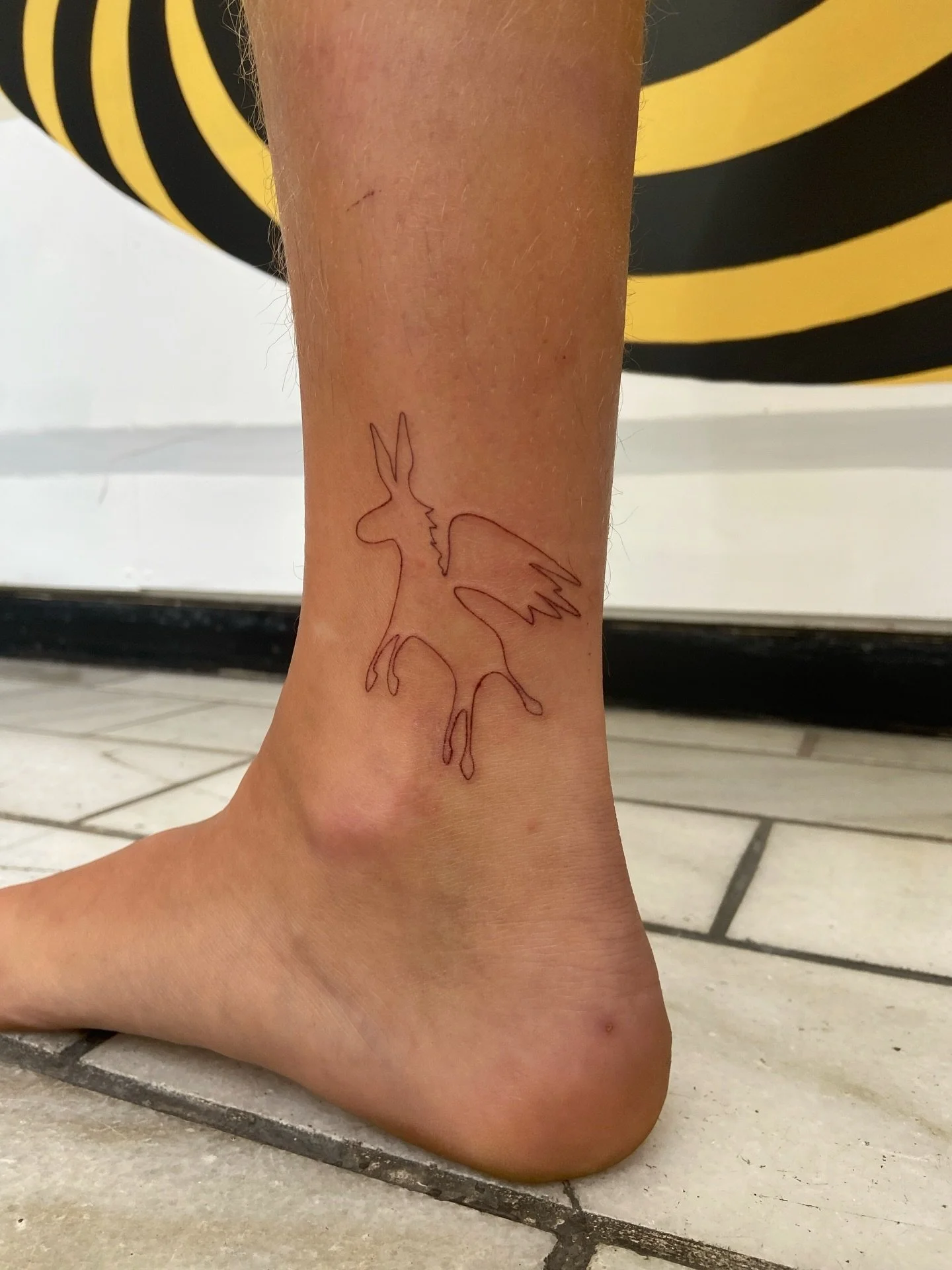 Late April 2026, and we&rsquo;re finally posting tattoos from 2026!!
.
First tattoo 🤎 and my first tattoo of 2026
(using Sarah&rsquo;s own illustration)
.
So lovely to meet you, Sarah! Love this placement you chose, and also the brown ink! 🤲🏽🤎