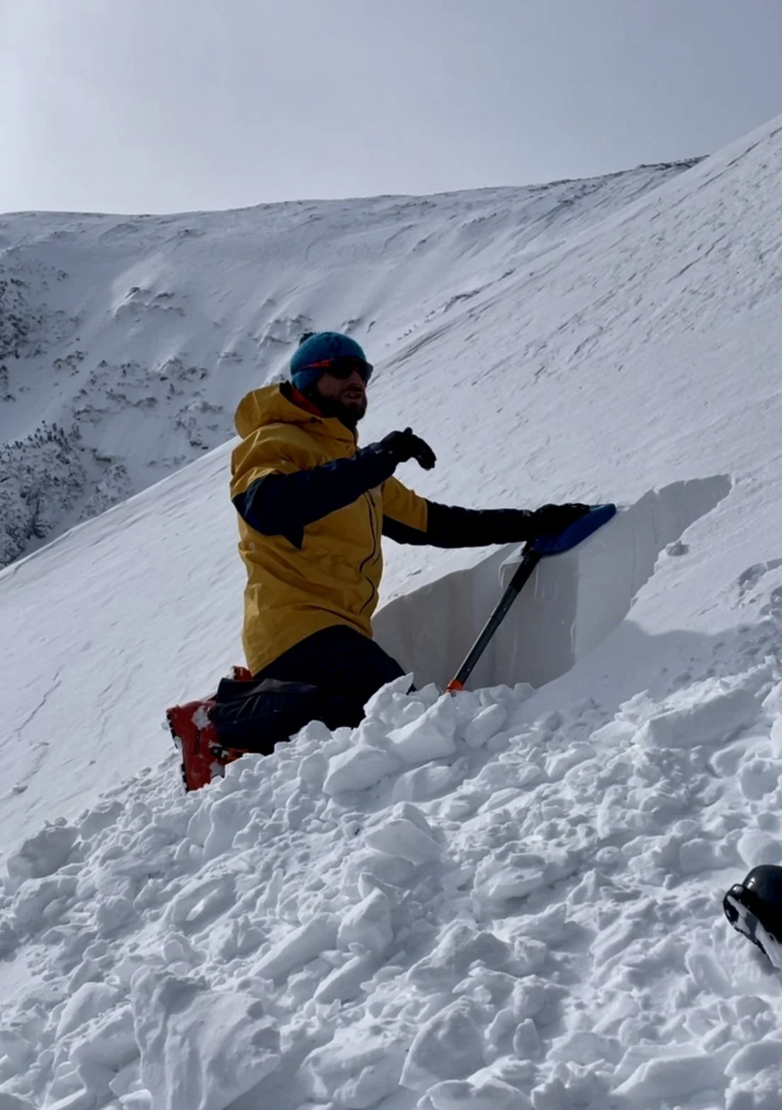 IFMGA guide evaluating snow and avalanche risk in Tuckerman Ravine, NH
