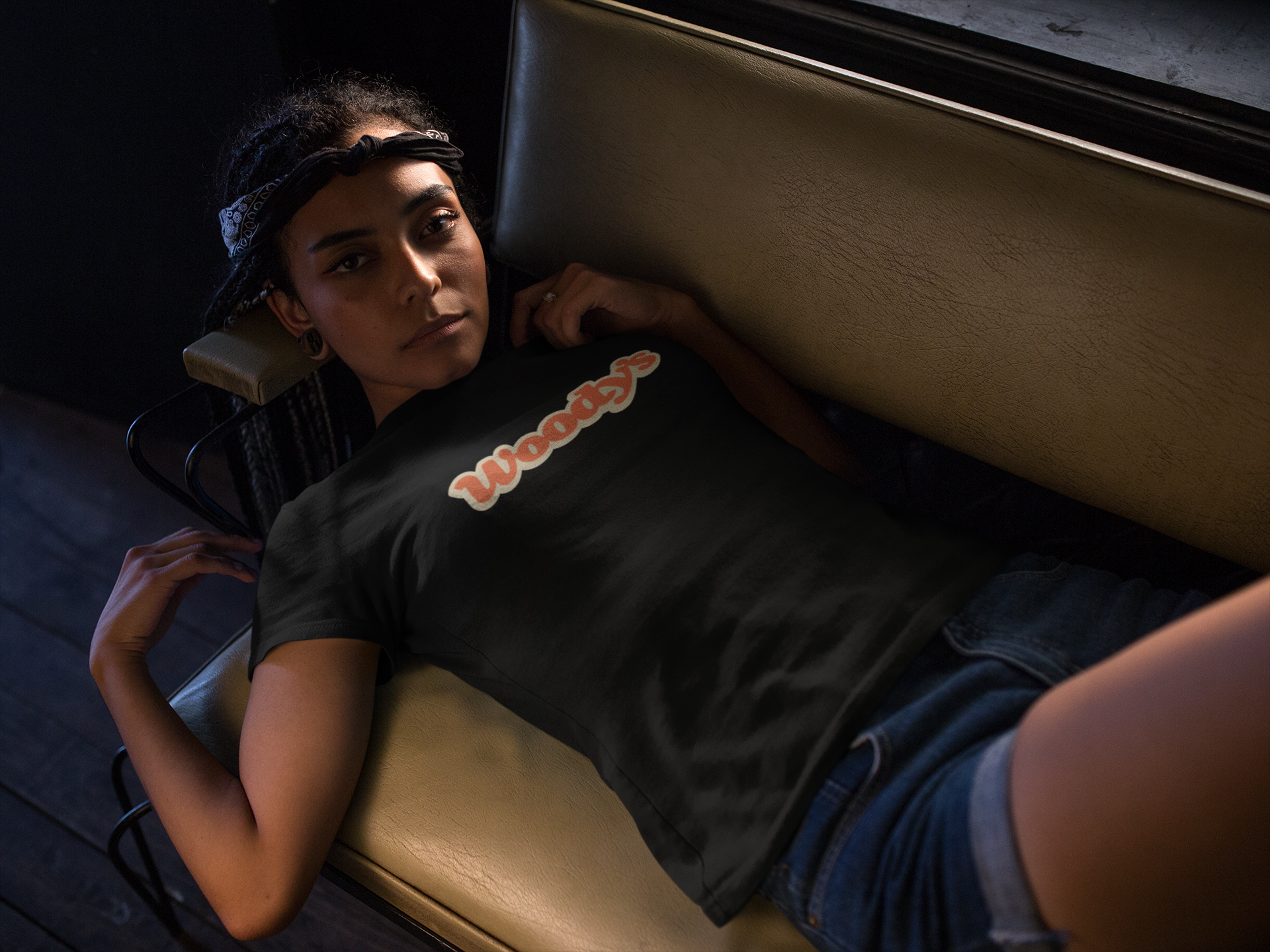 pretty-woman-wearing-a-t-shirt-template-while-lying-down-on-a-sofa-a17203.png
