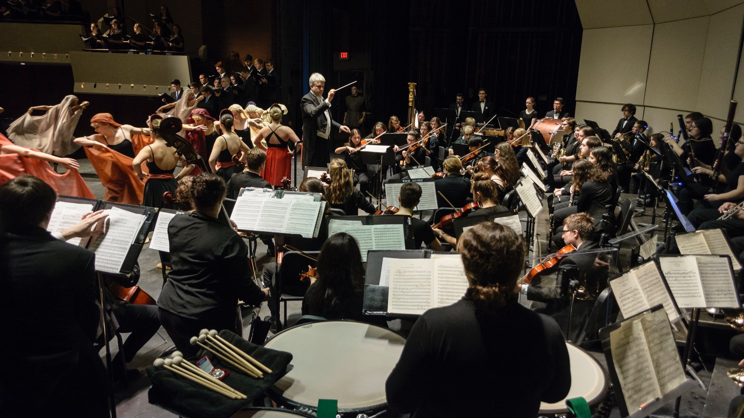 David conducting the UNH orchestra with choir and dancers