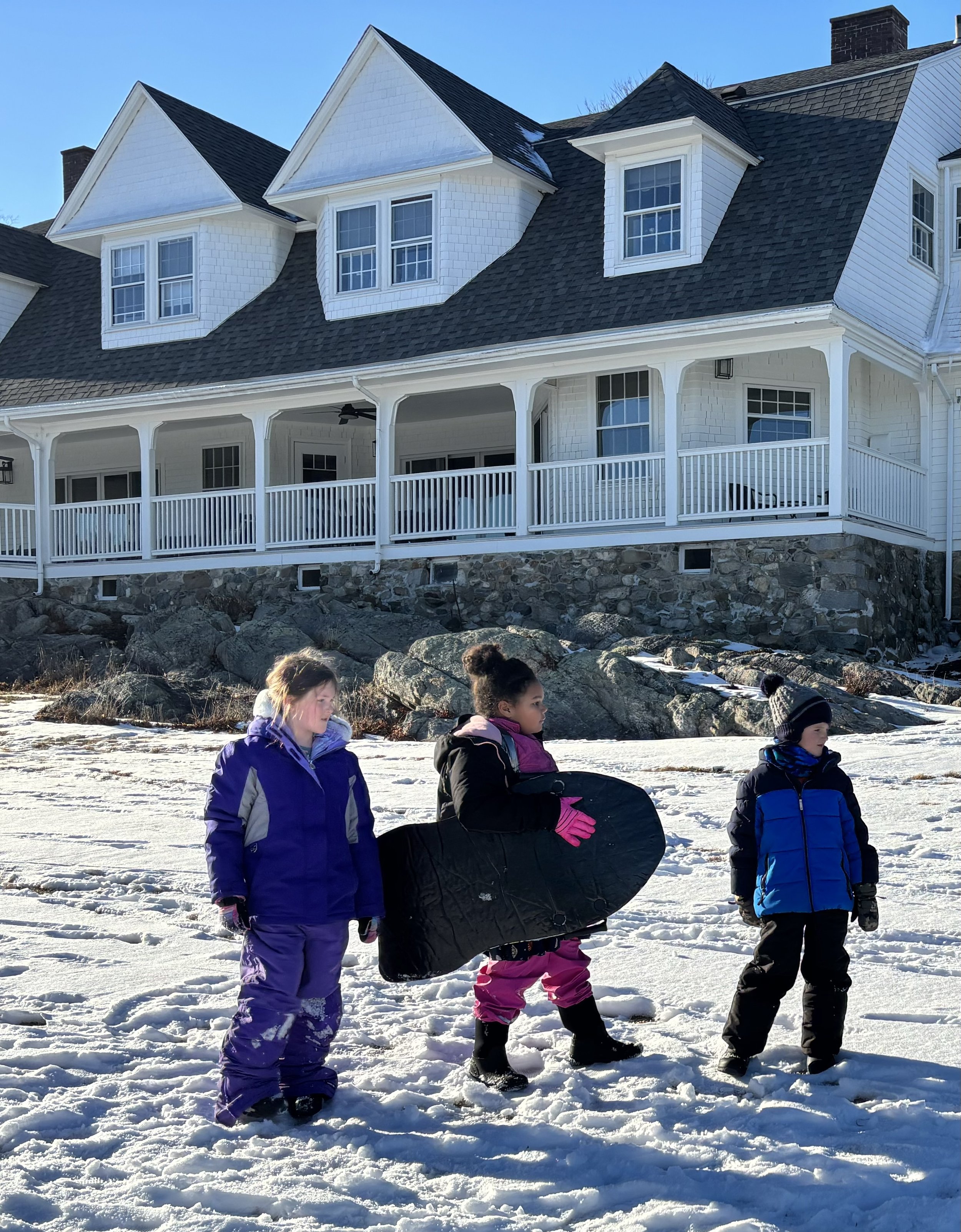 The lawns surrounding Carey Cottage become fun snowfields in winter.