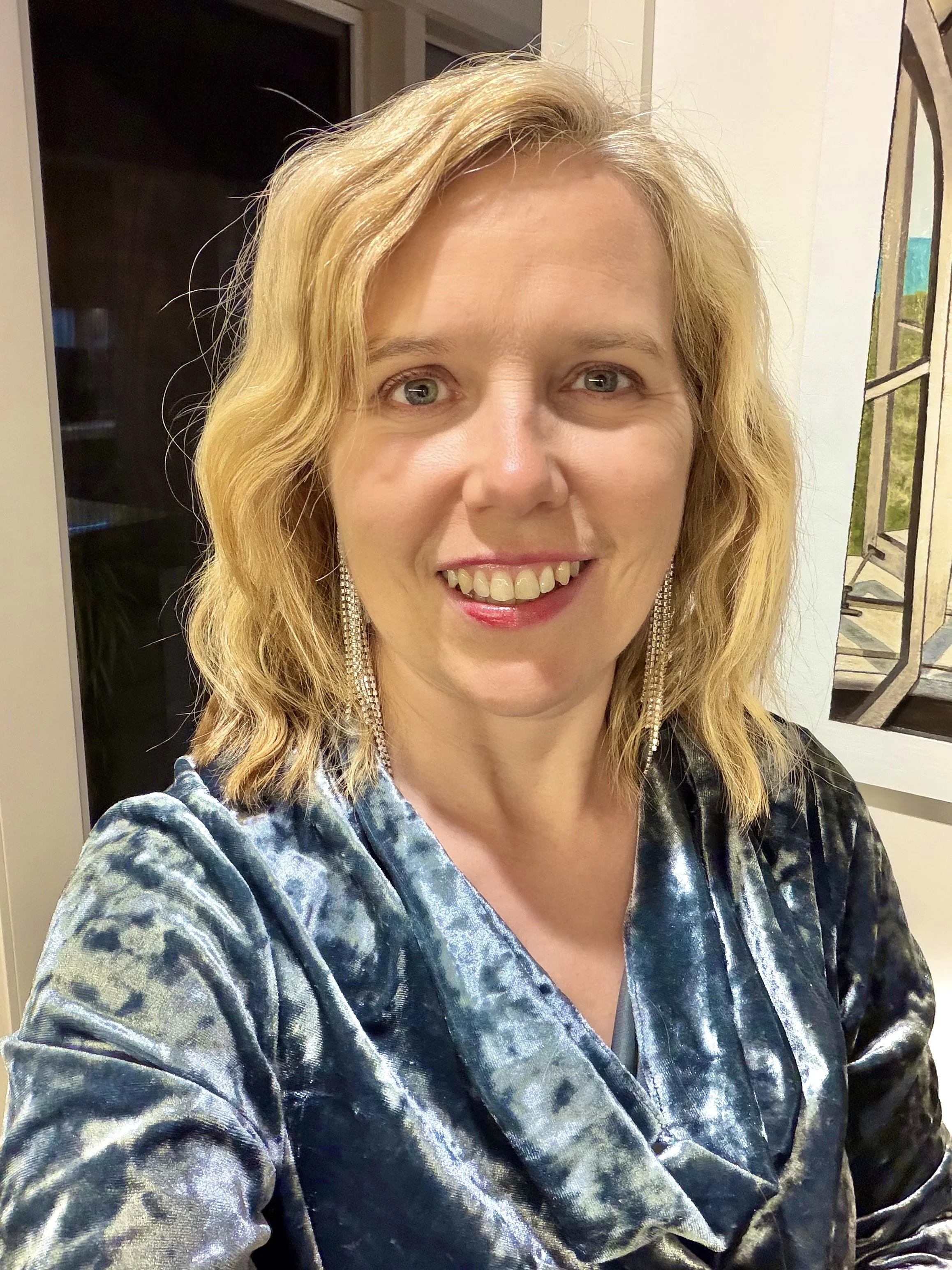 Suzie thoraval in a velvet top, adaptive stability, adaptive leadership, leadership coaching, coaching, coach