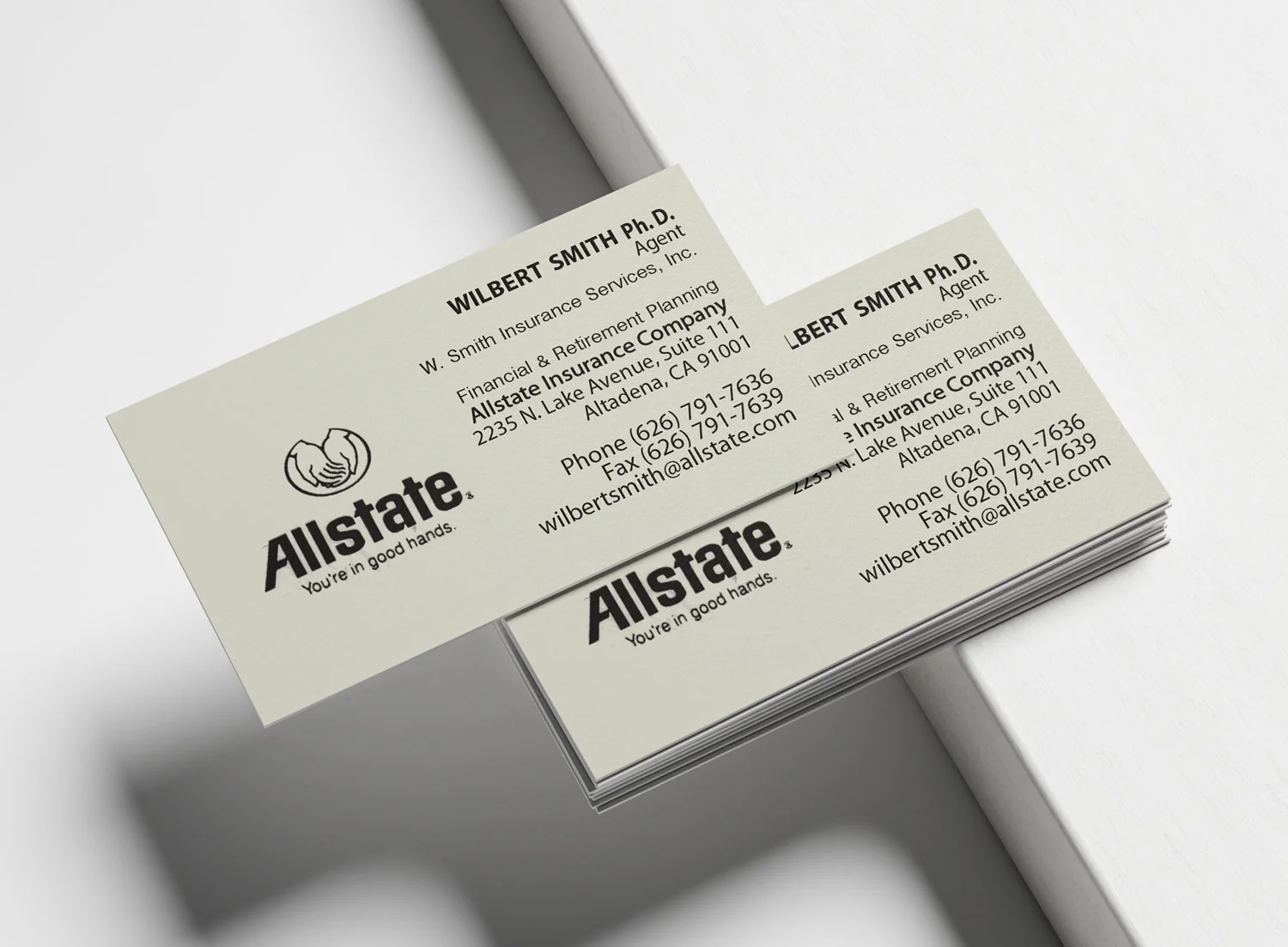 Stack of business cards for Wilbert Smith, an insurance agent at Allstate Insurance. The cards include contact details and the Allstate logo.