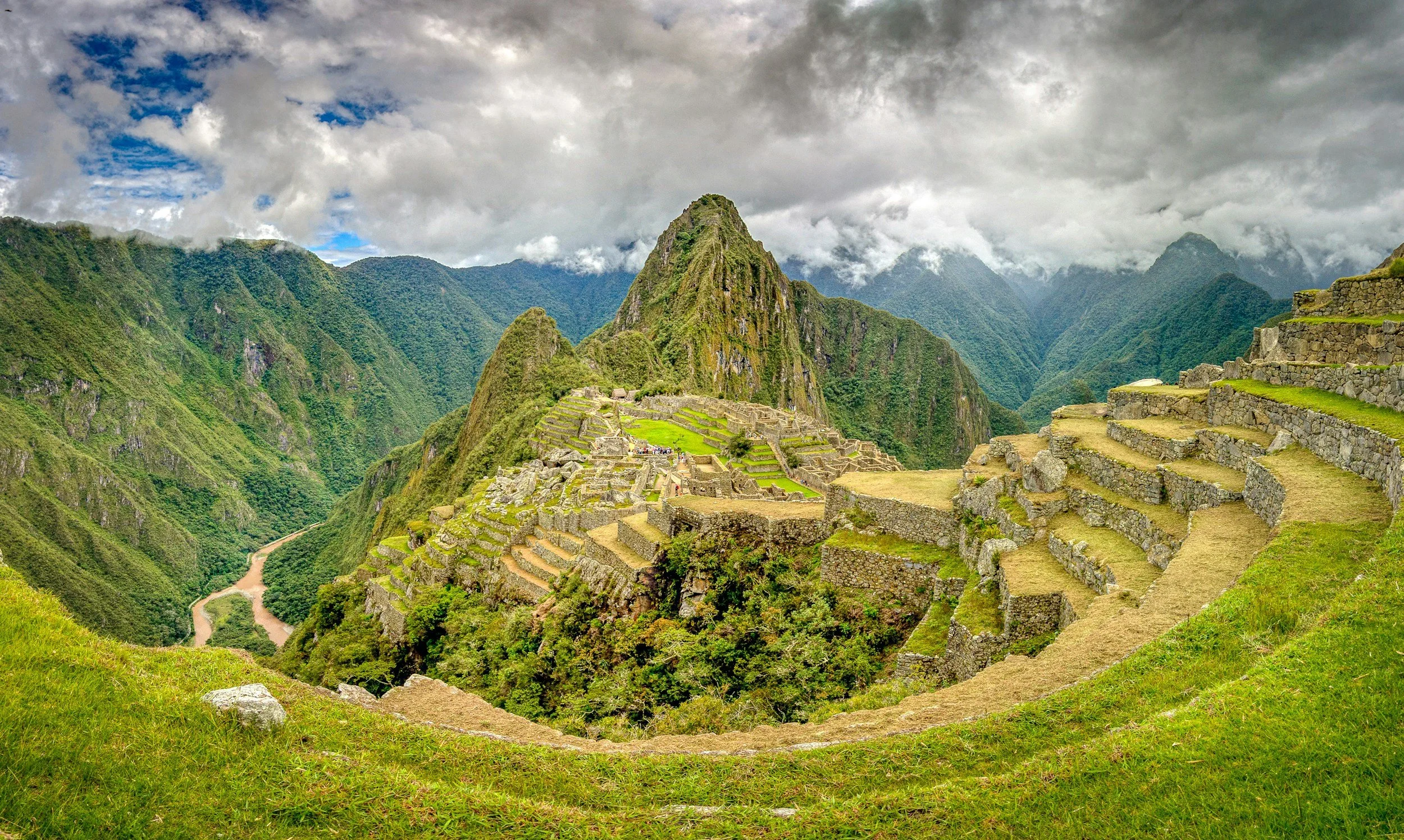 Machu Picchu citadel at sunrise with mist rising over the Andes mountains, Peru