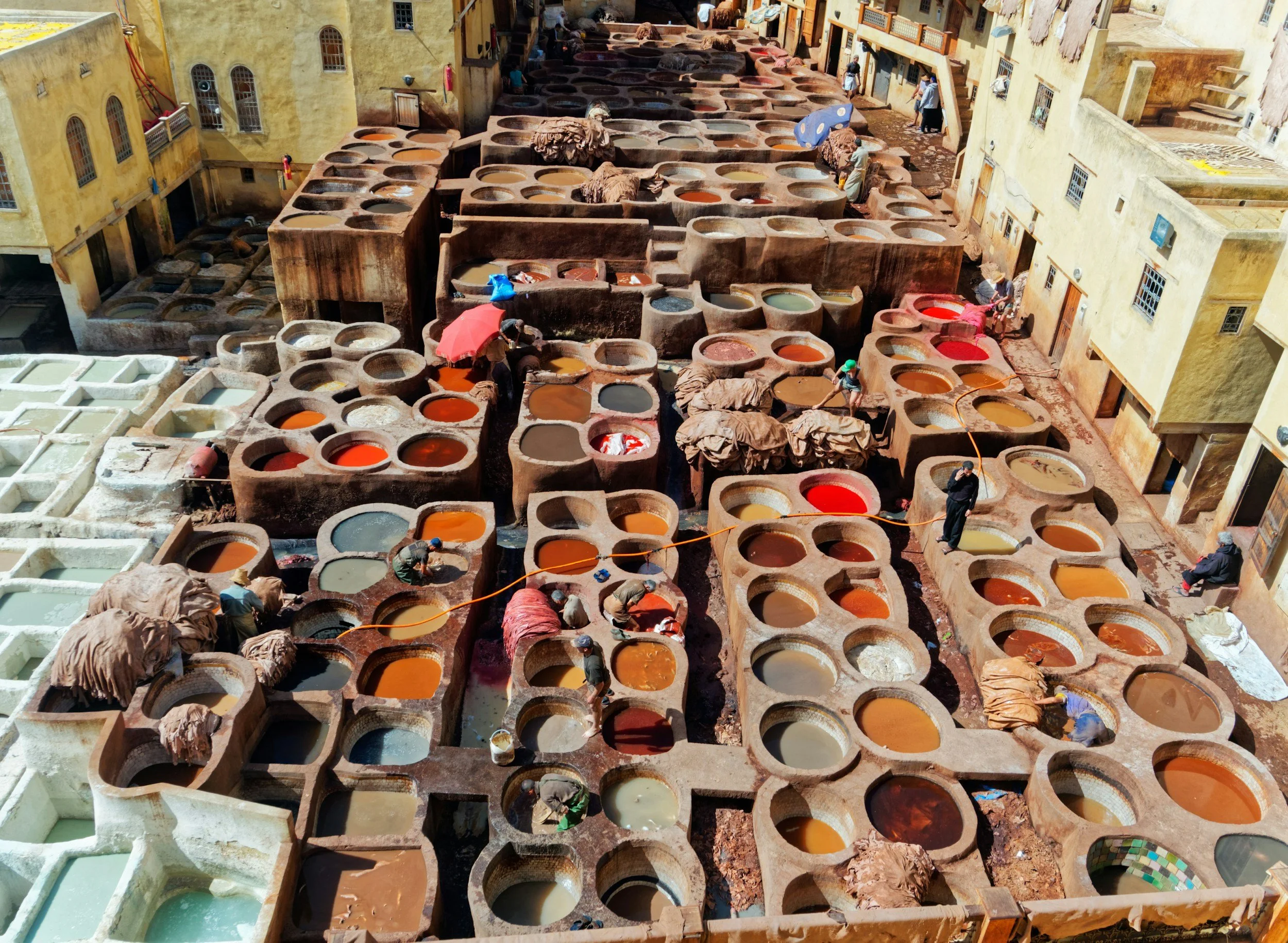 Traditional leather tanneries viewed from a rooftop terrace in the Fès medina, Morocco
