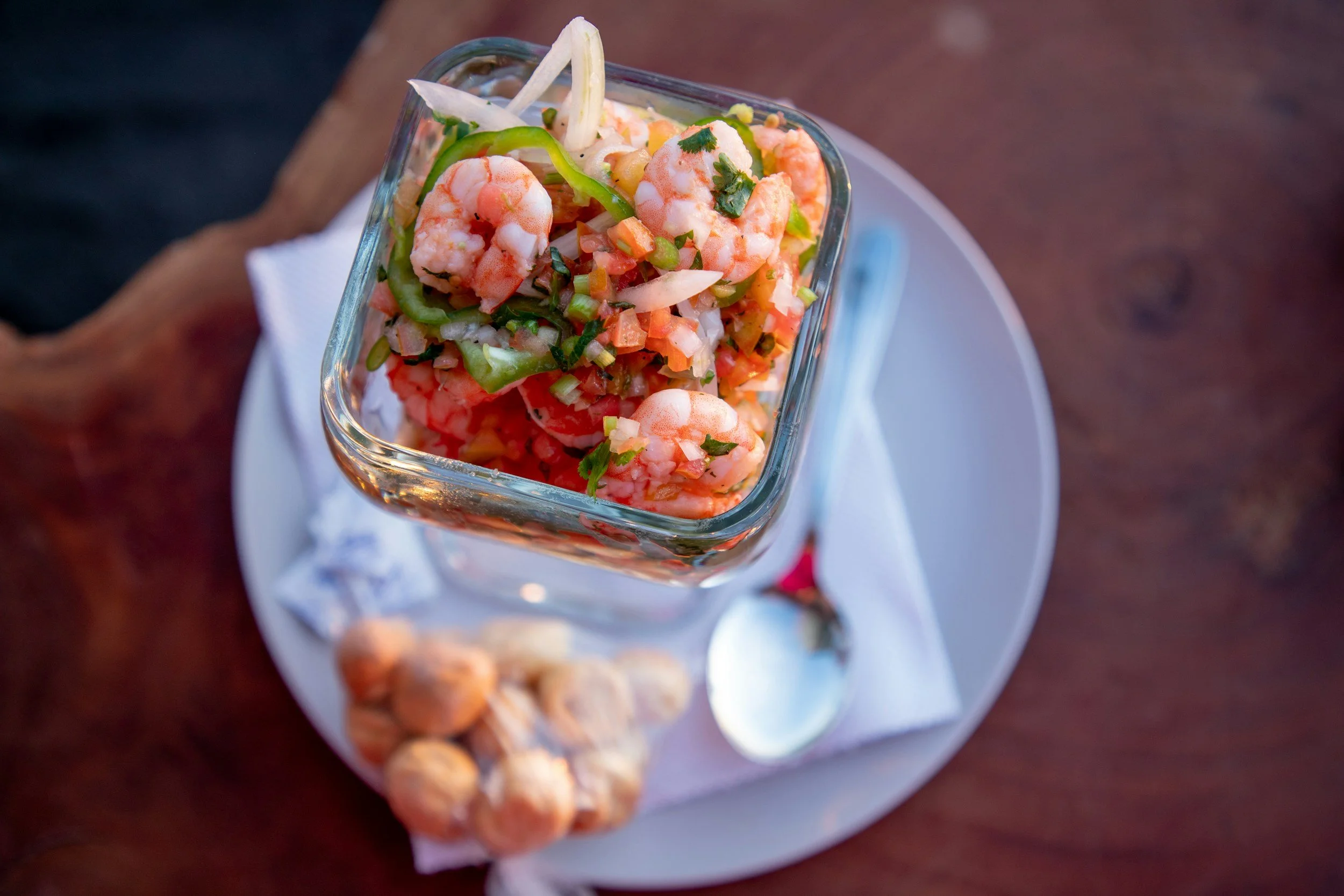 Fresh Peruvian ceviche with shrimp, lime and chilli served in a glass dish on a private culinary tour in Peru