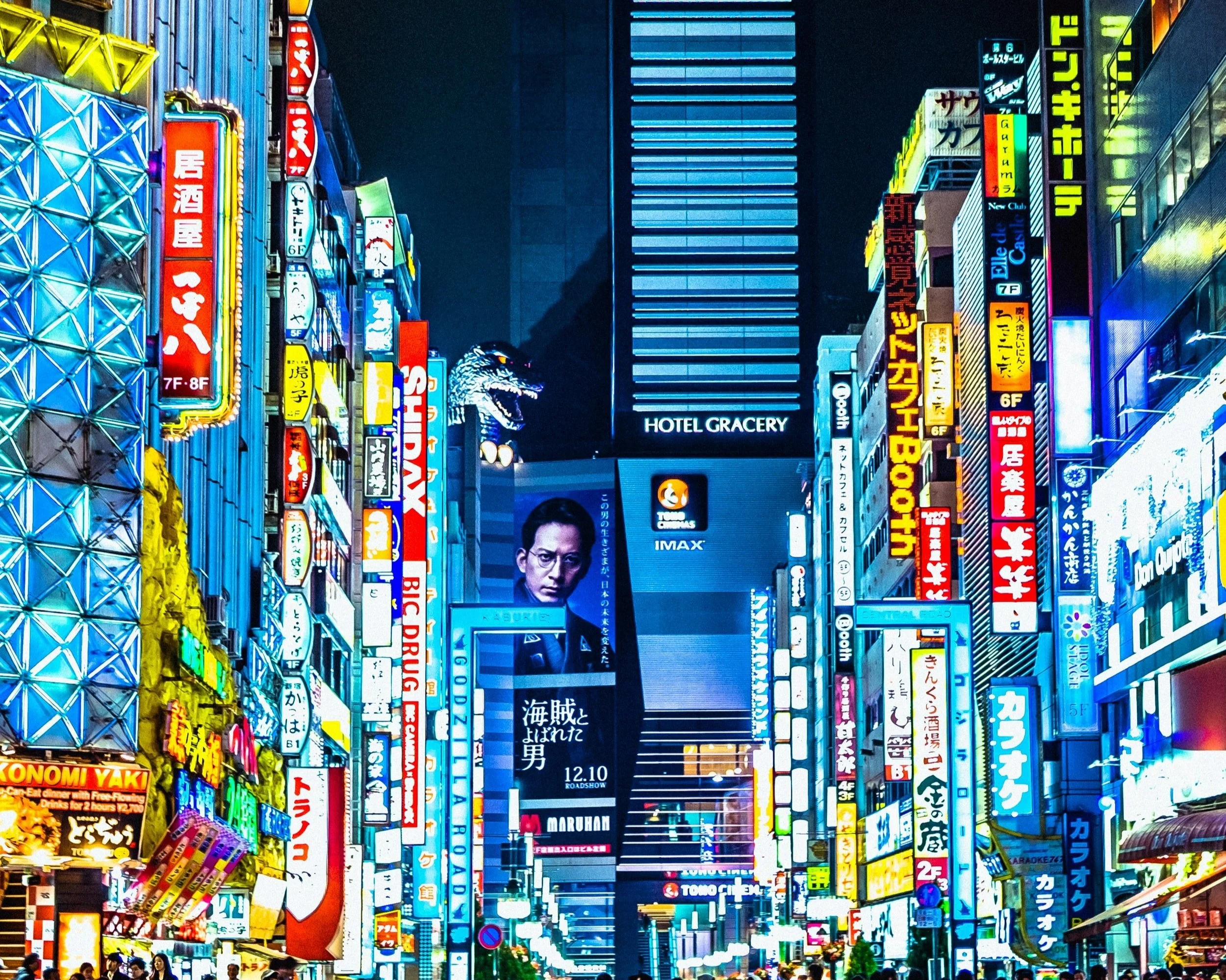 Neon-lit streets of Shinjuku in Tokyo at night on a private luxury tour of Japan