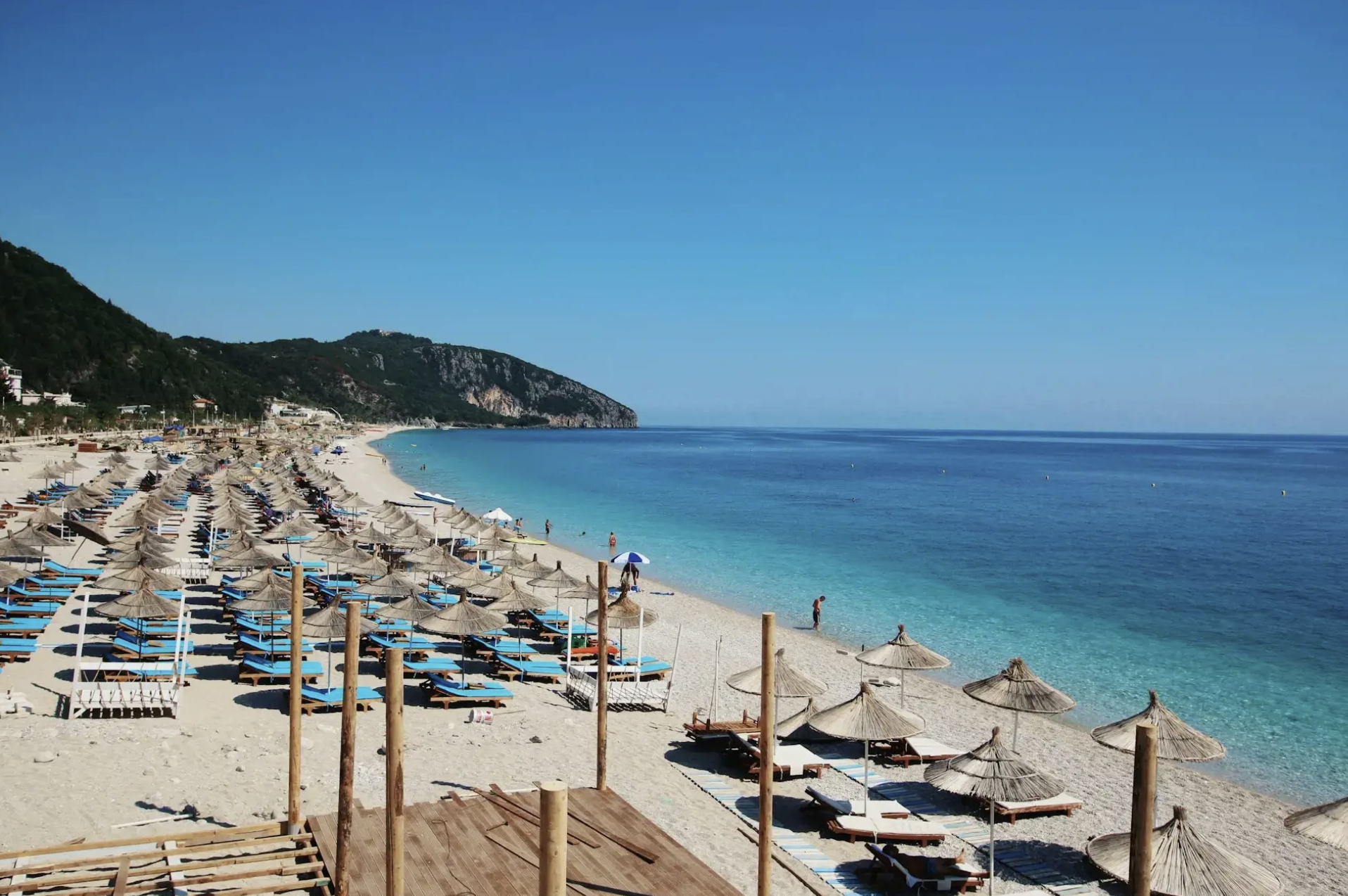 Seaside village along the Albanian Riviera with clear blue waters and coastal views