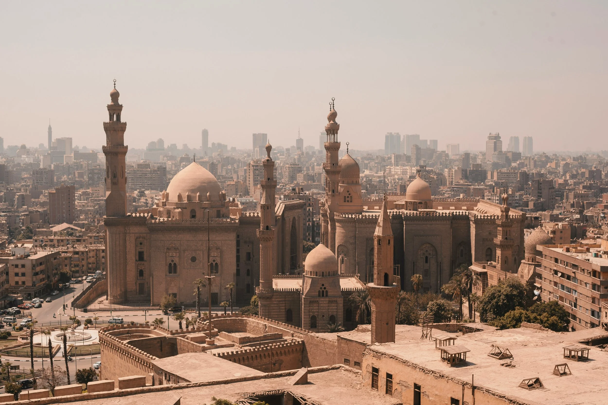 Aerial view of Cairo with the domes and minarets of the Sultan Hassan Mosque and Al-Rifa'i Mosque rising above the city, Egypt