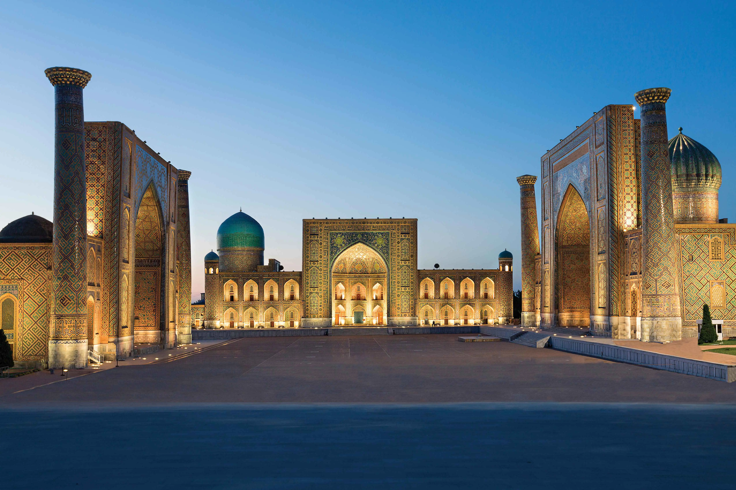 Registan Square Samarkand Uzbekistan illuminated at dusk Silk Road luxury private tour