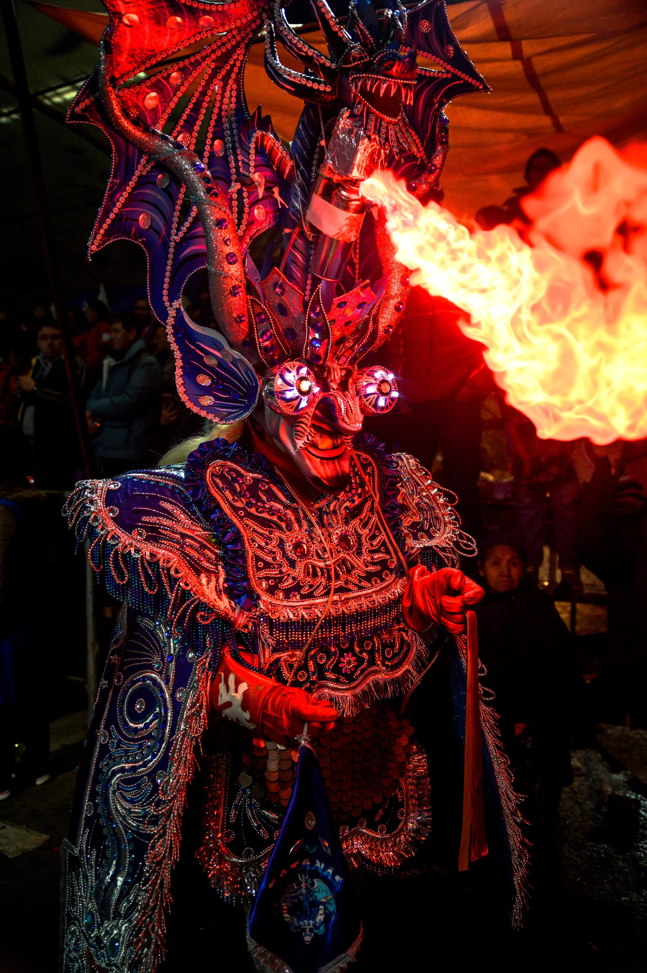 Elaborately costumed dancer wearing a jewelled devil mask at the Carnival of Oruro, one of Bolivia's most spectacular traditional festivals