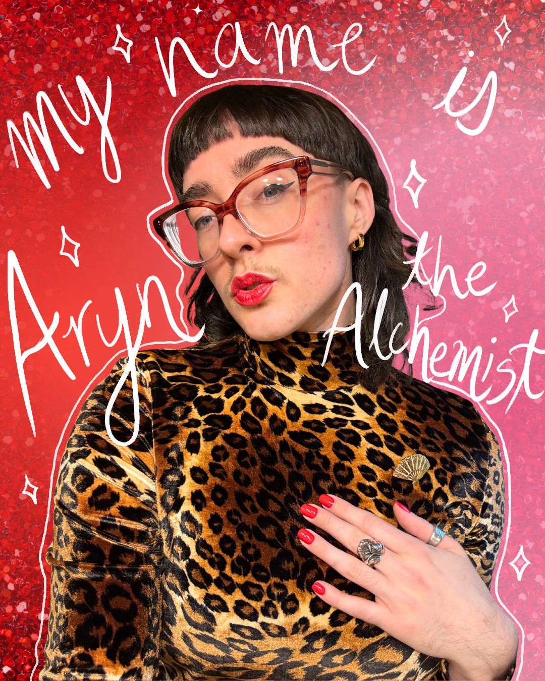 An image of Aryn Scanlon wearing a leopard print shirt and red lipstick. They're against a red and pink background with white text that says My name is Aryn the Alchemist.