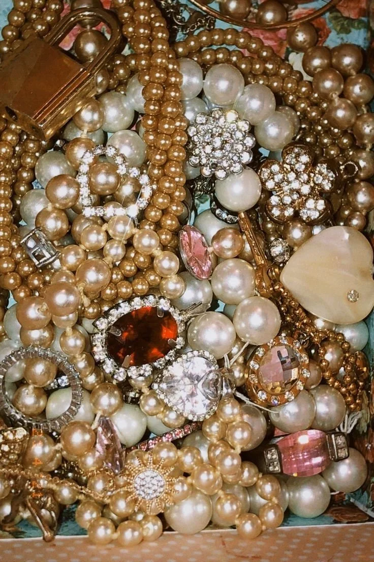 A picture with gems, sparkles, and brooches.