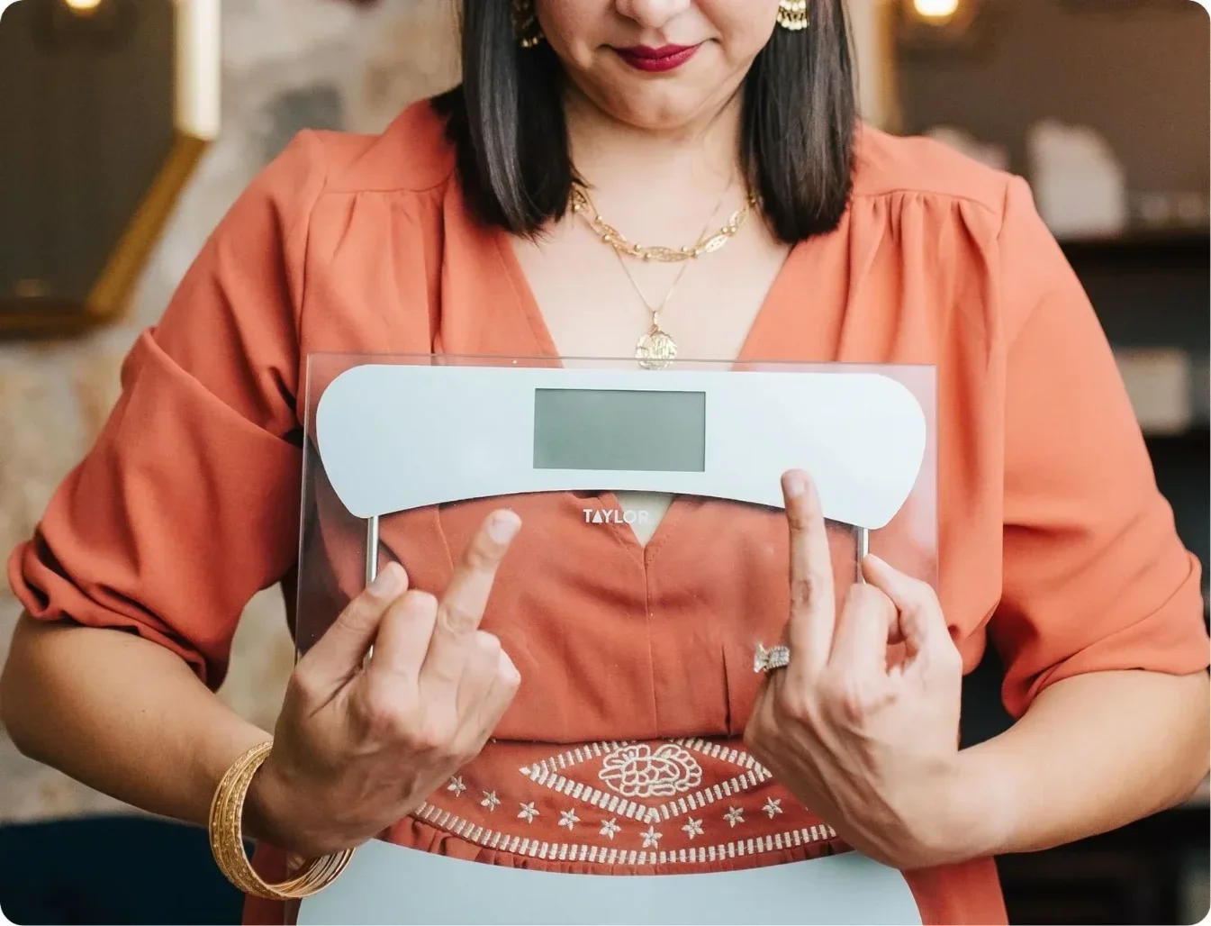 Natalia flipping the bird at scales