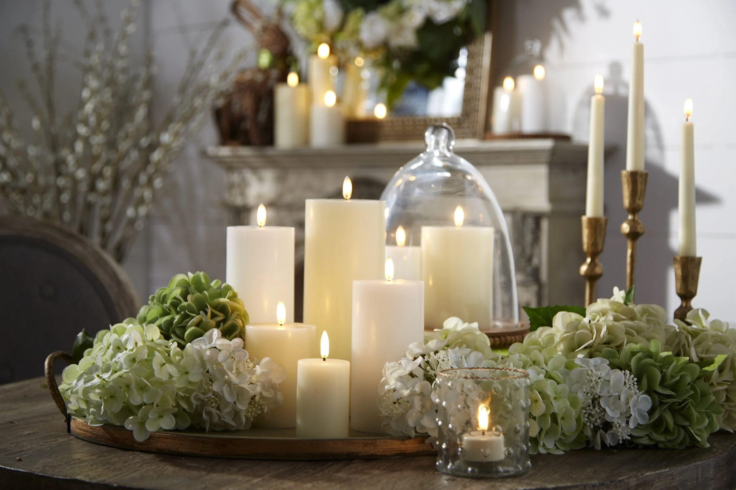 Candlescape on a table, candles on a table with floral sprays, romantic candle display