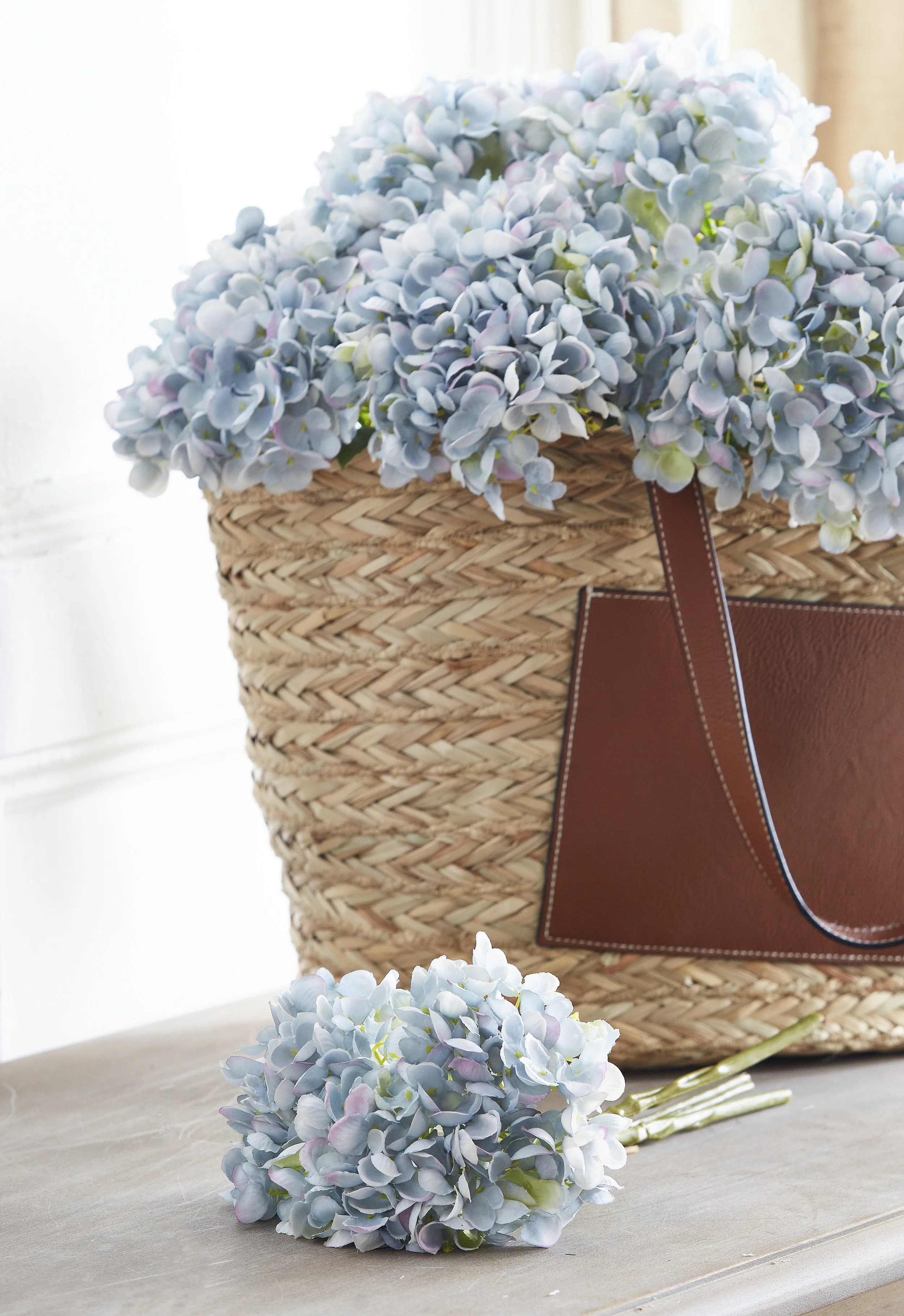 blue hydrangeas, natural grass fiber basket with leather handles