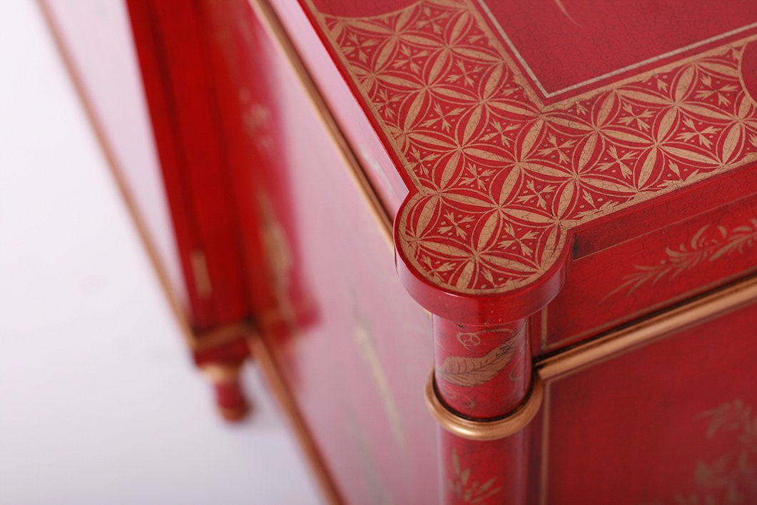 Detail of a hand painted bespoke sideboard with red and gold detailing. For interior designers, joinery and furniture manufacturers and private individuals.