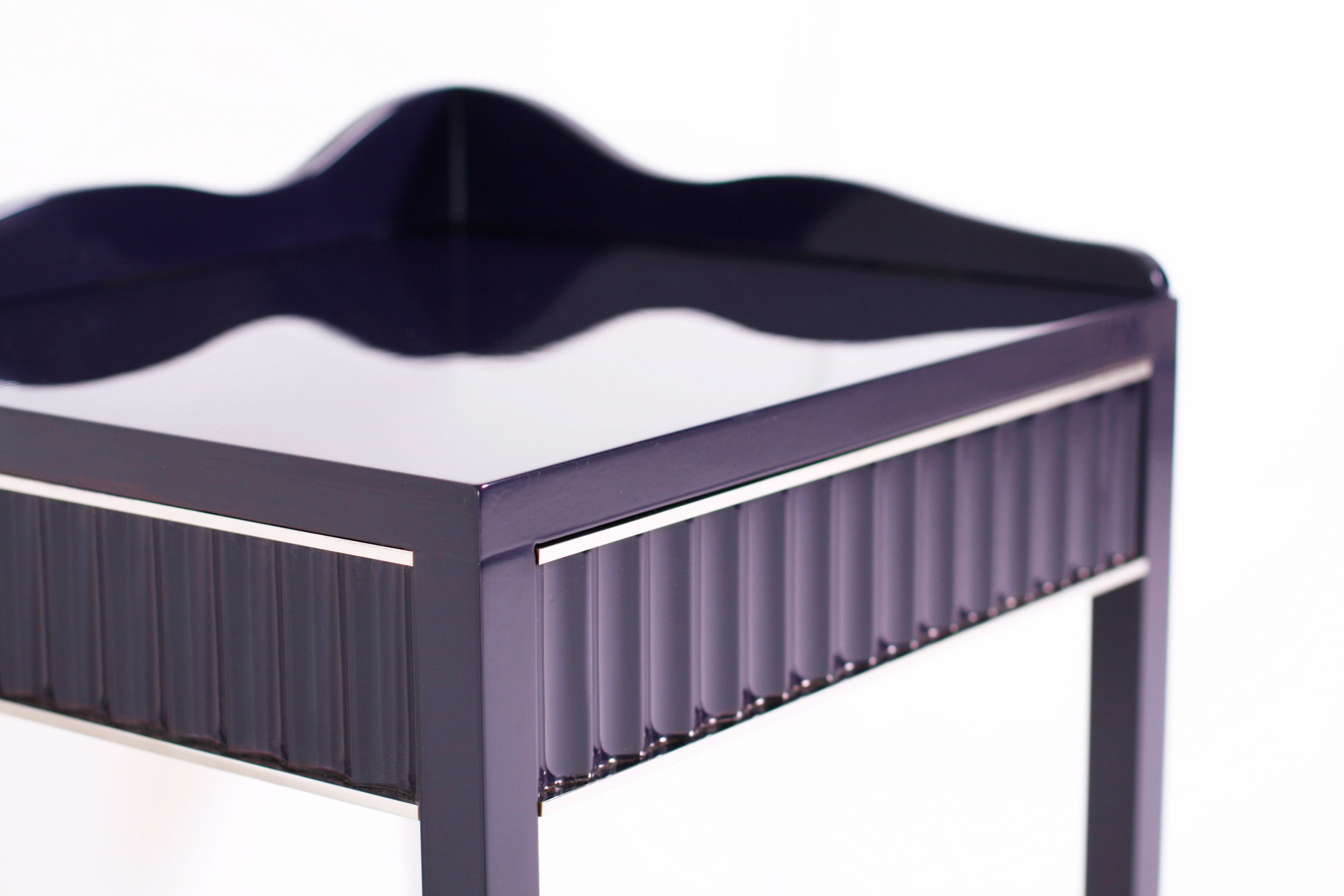 A bespoke side table with fluting detail to the drawers and sides with solid nickel inlays. For interior designers, joinery and furniture manufacturers and private individuals.