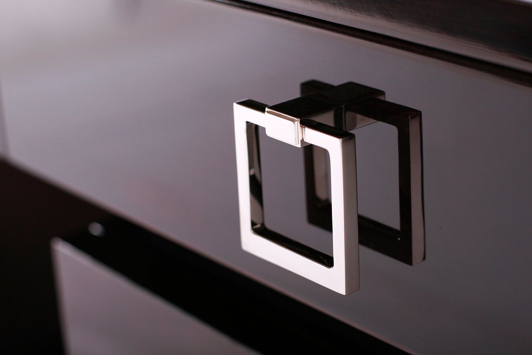 Close up detail of a bespoke nickel furniture handle. For interior designers, joinery and furniture manufacturers and private individuals.