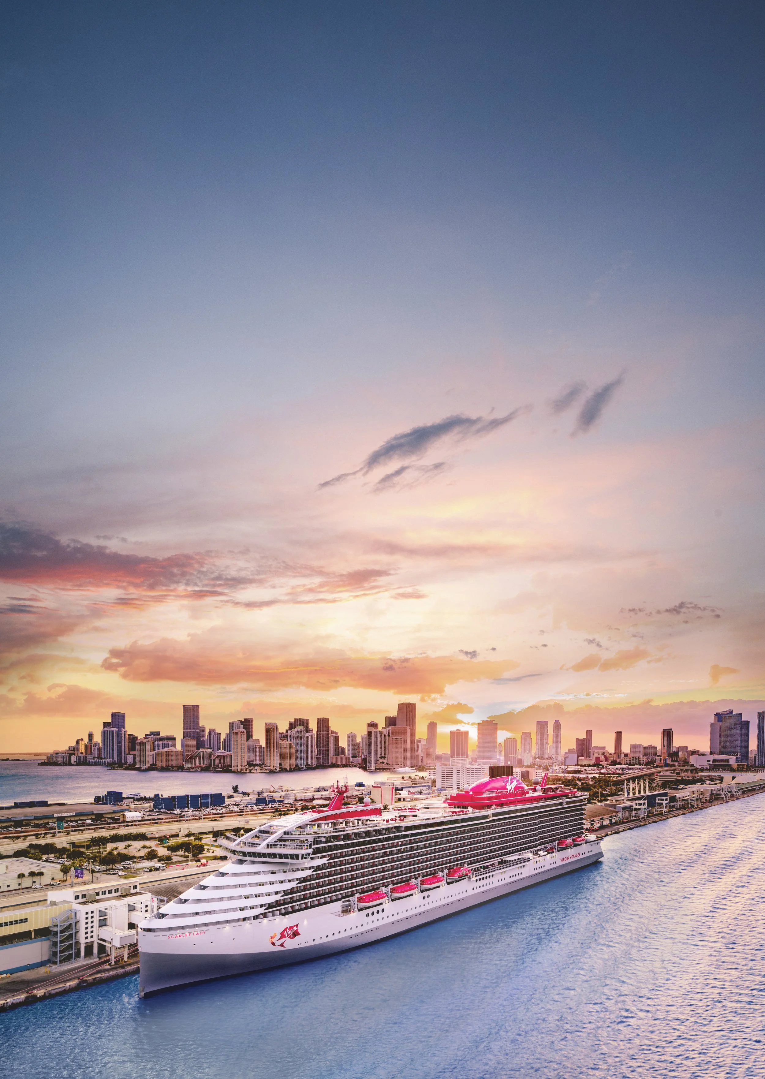 Virgin Voyages cruise ship docked in Miami at sunset — book your Virgin Voyages sailing through a Gold Tier First Mate travel advisor
