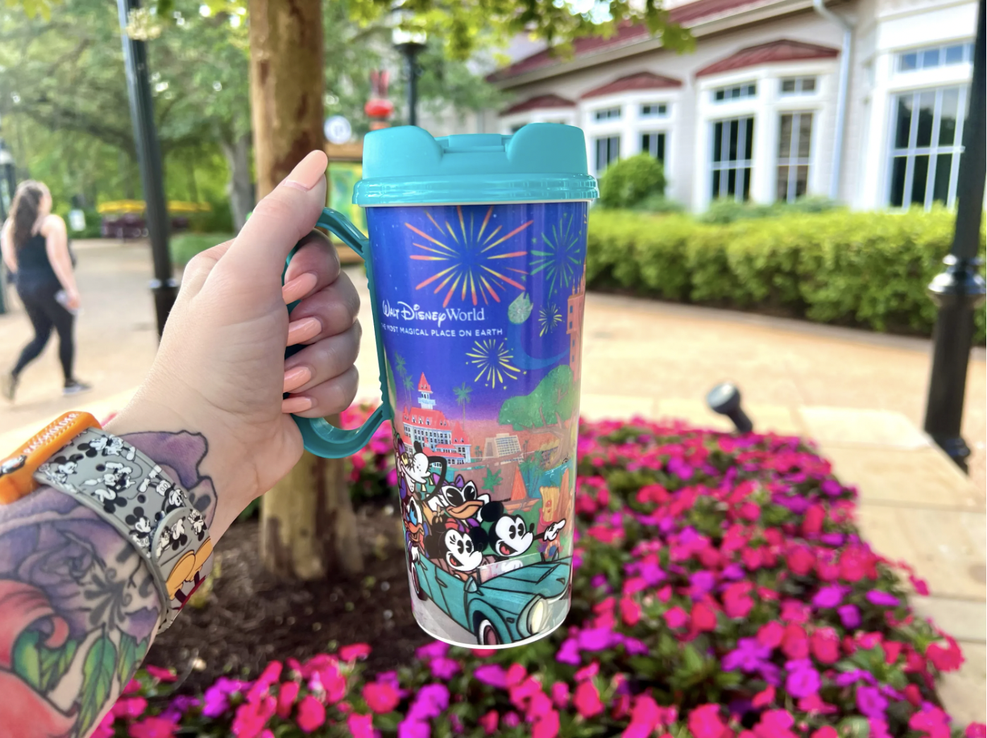 Walt Disney World resort refillable mug held outdoors at a Disney Resort