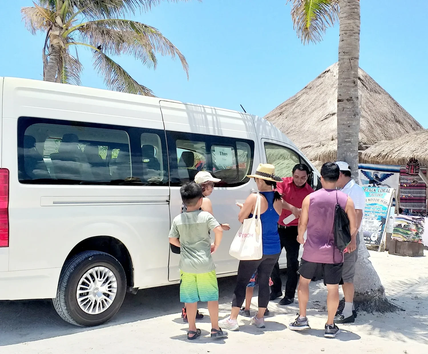 Cruise passengers boarding a shuttle van near the Cozumel cruise port
