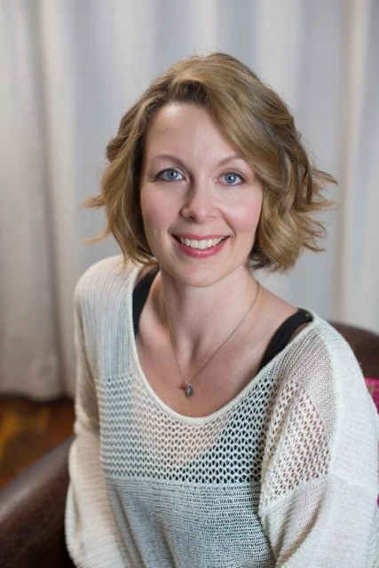 dustienne headshot.jpeg