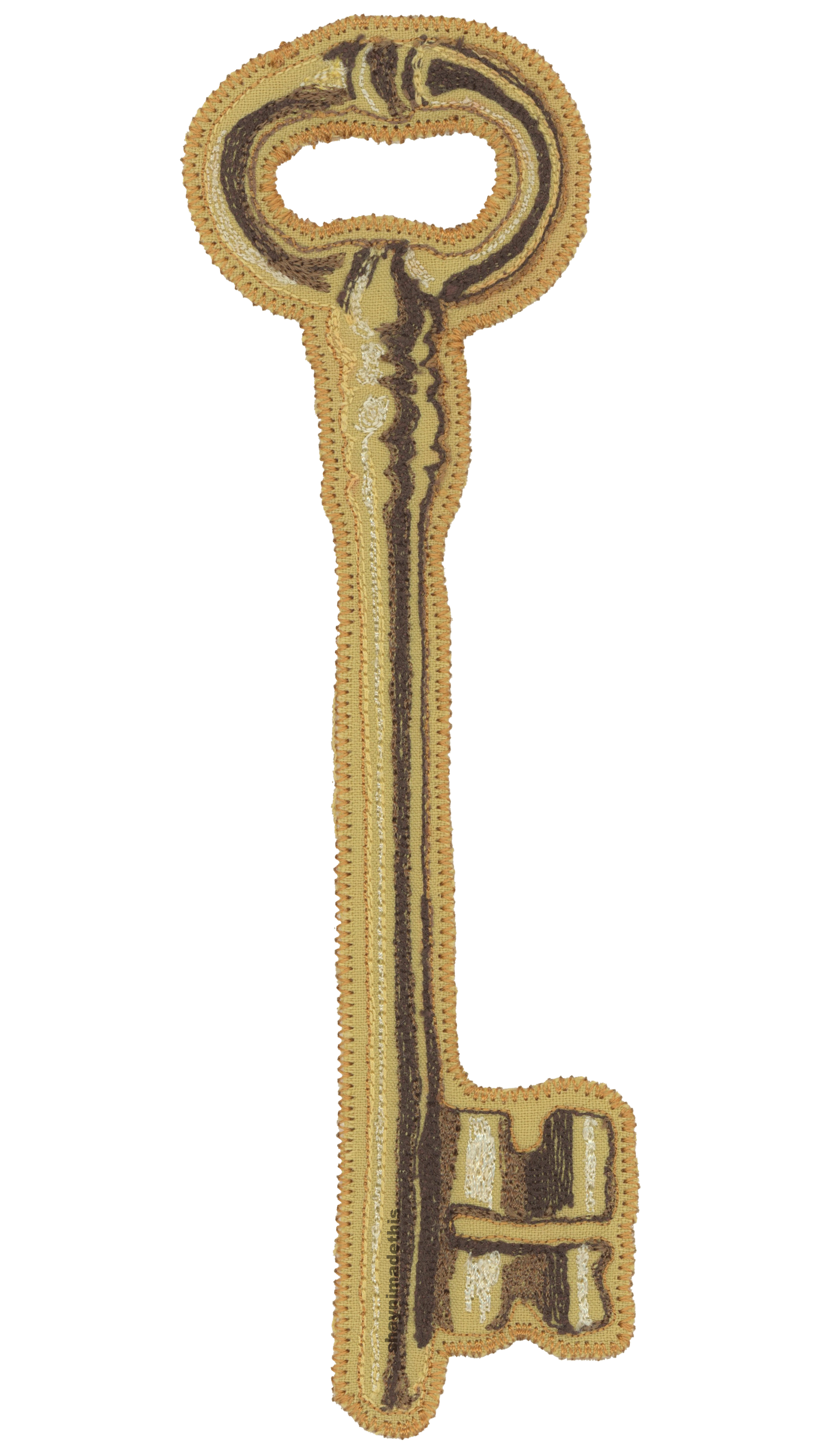 Gold key patch with embroidered details. 1/24/26