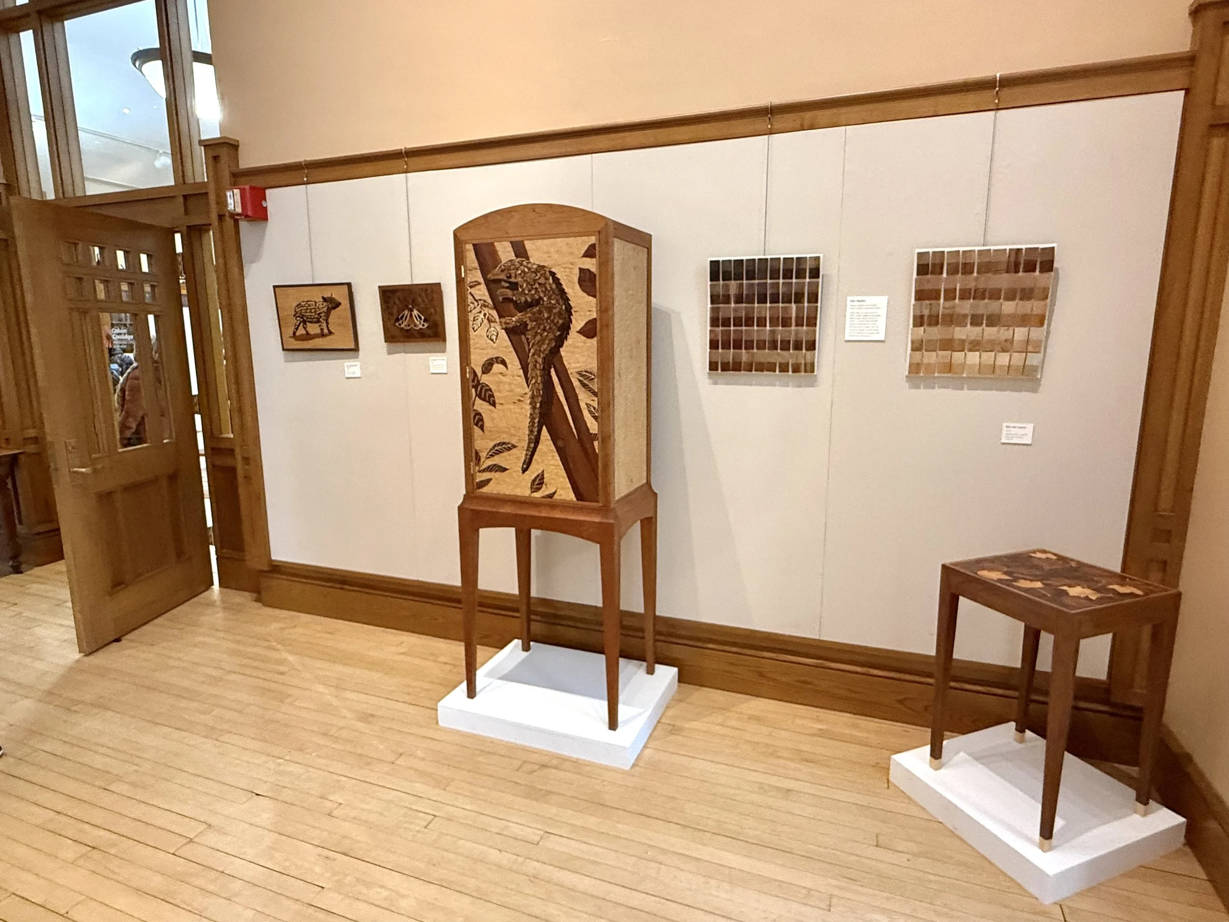Photo of the gallery space at the Hosmer Gallery with some of my marquetry pieces on display