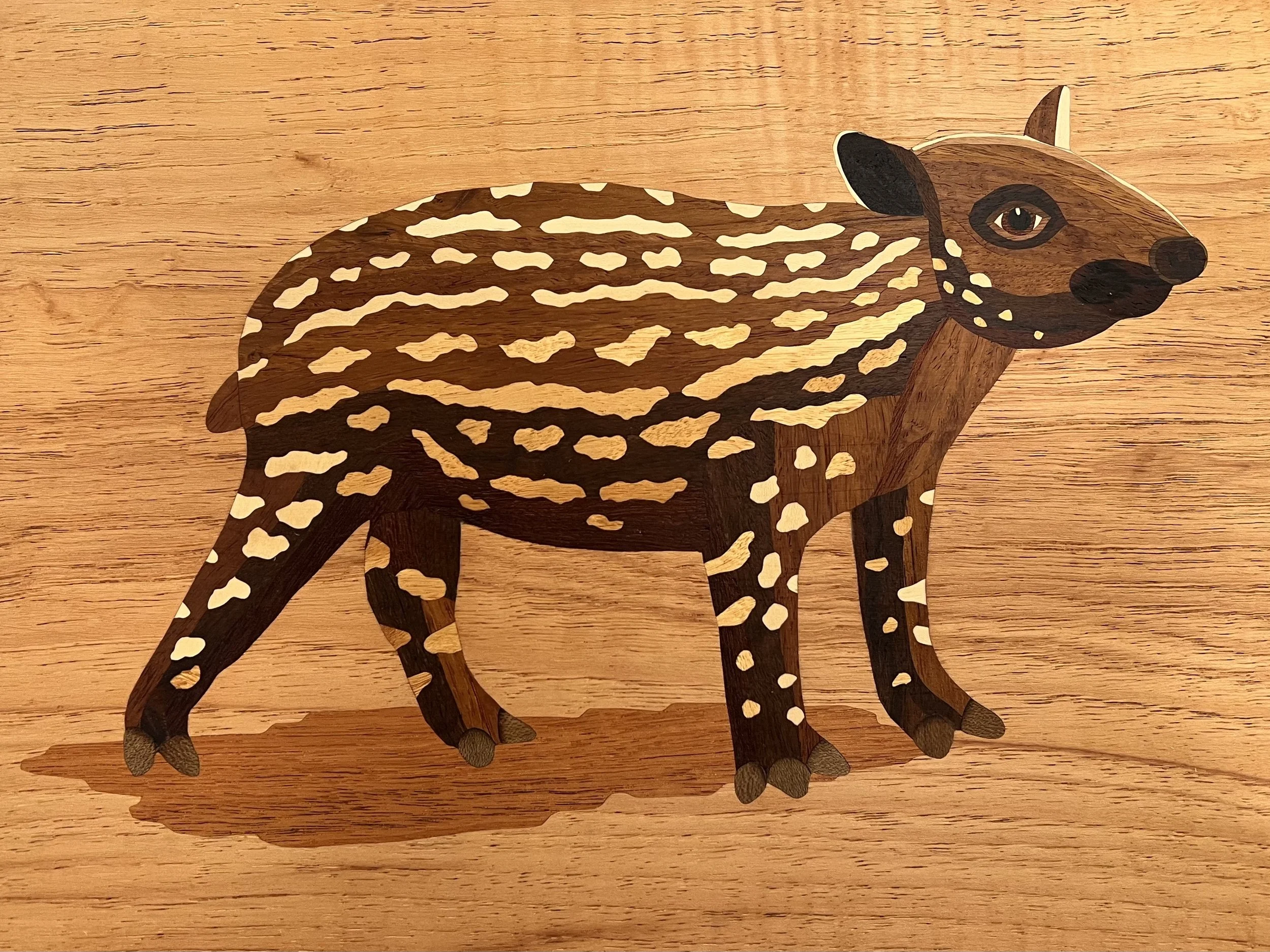 Marquetry image of a baby Baird's tapir