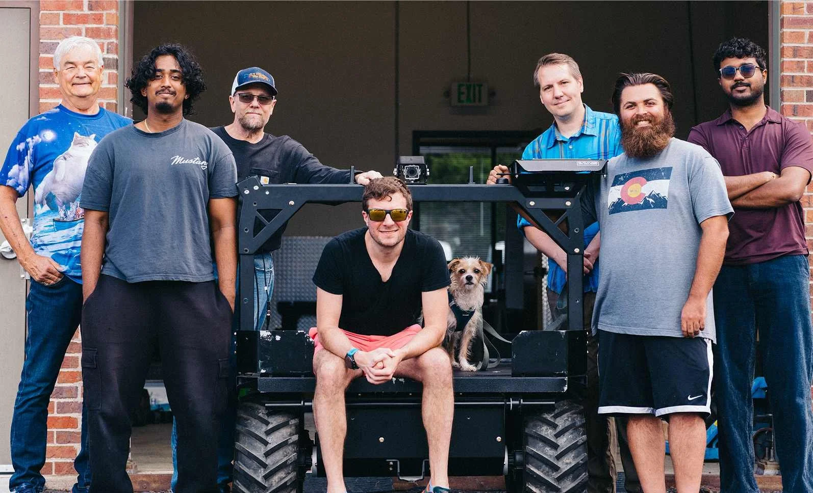 Seven Stridar employees (and the office dog) posing with the Siderunner UAV