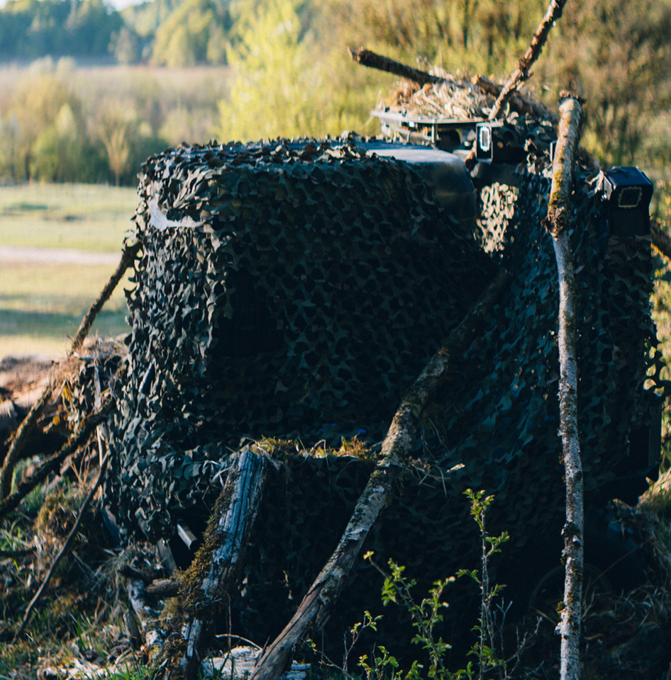 Siderunner UAV camouflaged with a ghillie blanket.