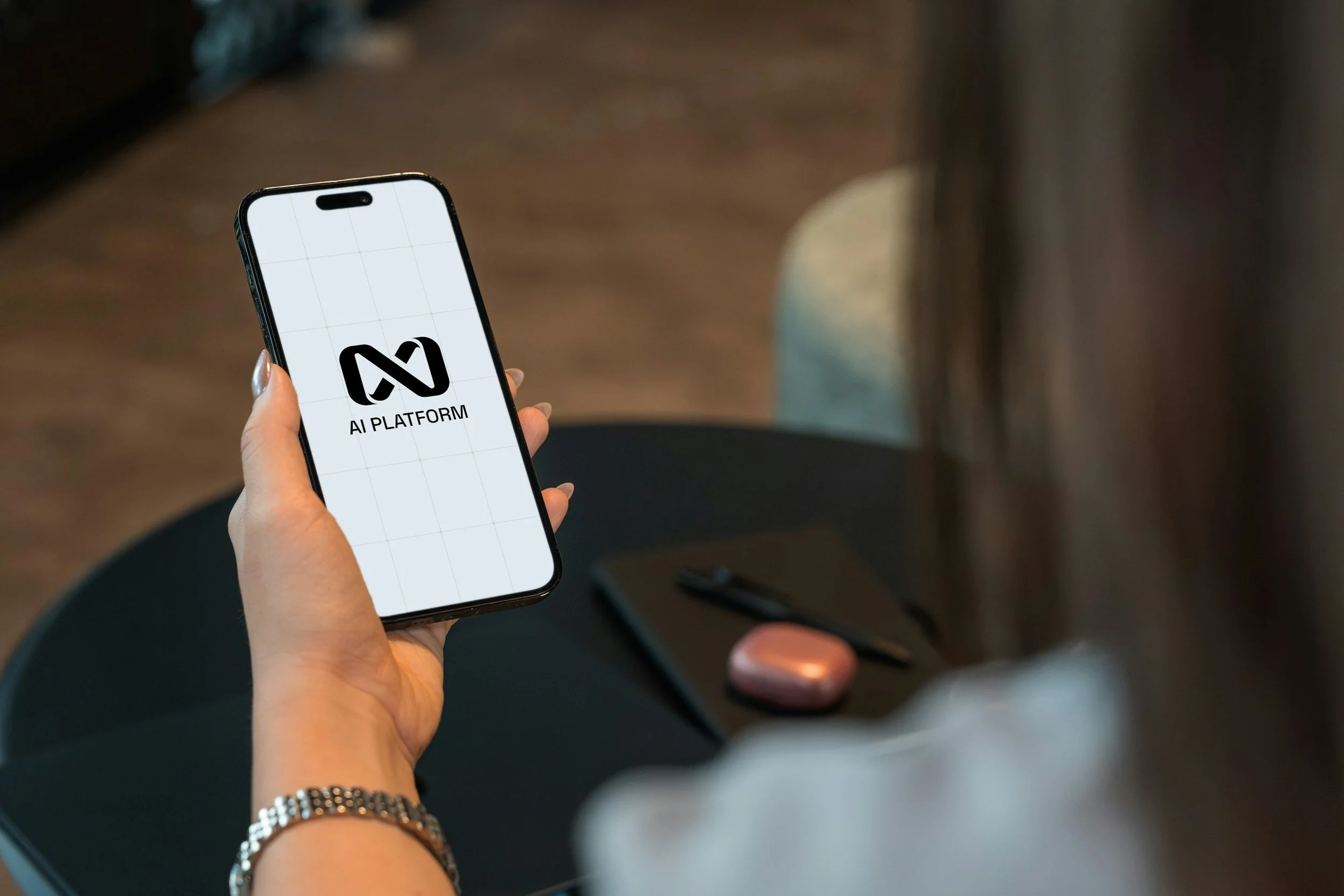 A person holding a smartphone displaying the AI Platform logo.
