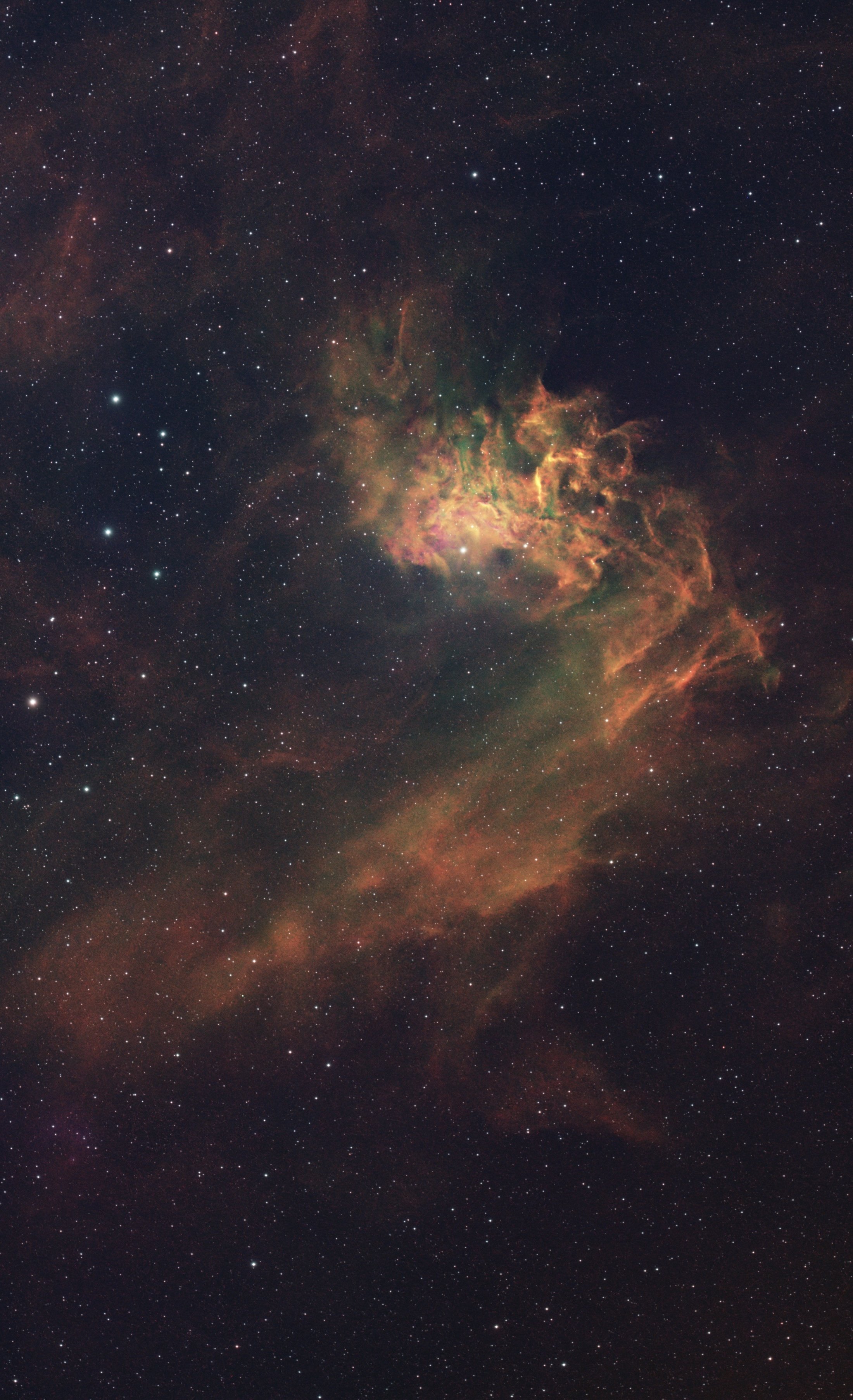 A stunning view of a colorful nebula with a dense star field in deep space.