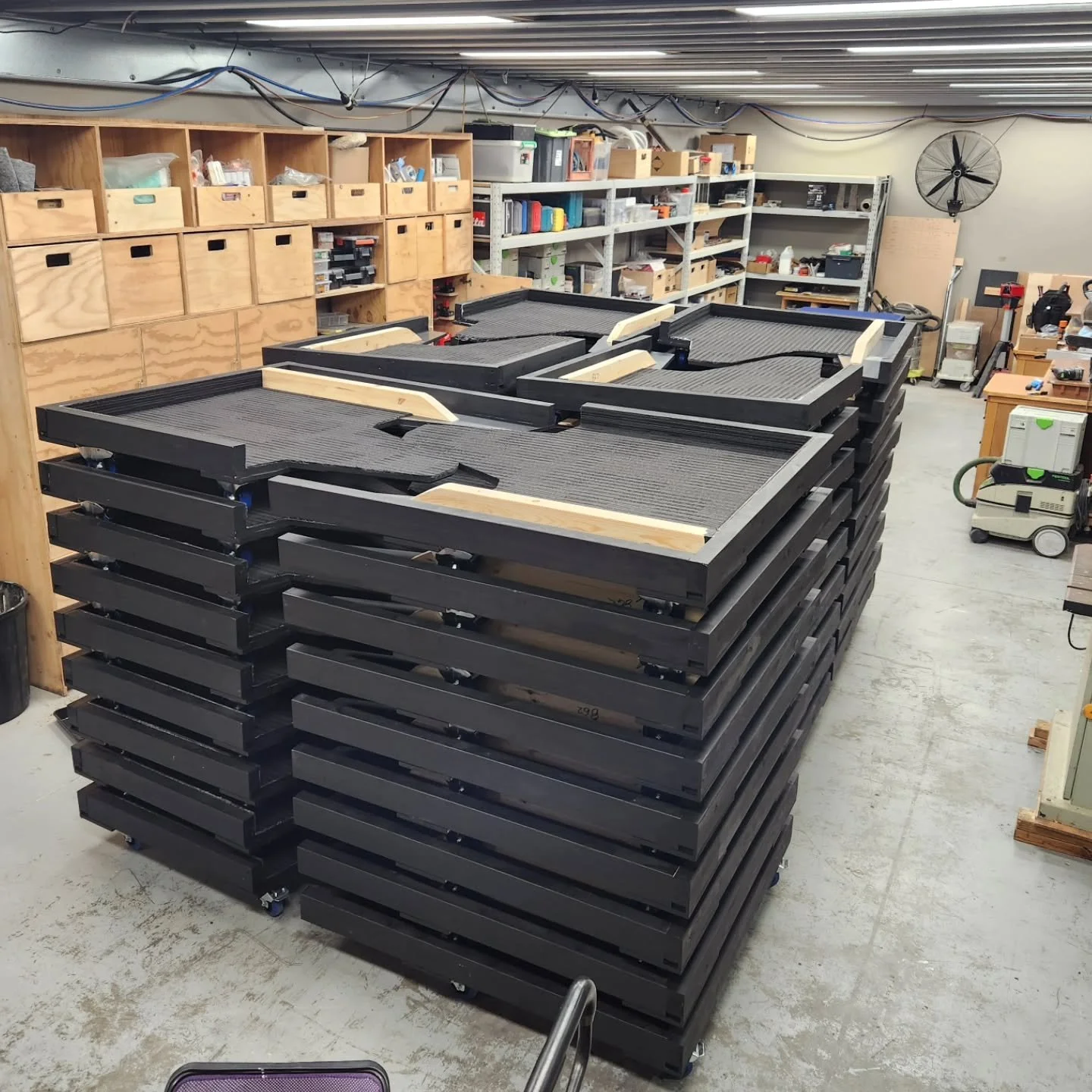 96x custom broadcast desk dolleys. We designed them to interlock and nest for storage. That was alot of castors.