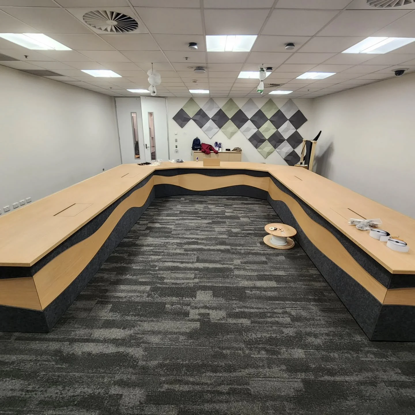 Custom 20 person video conferencing desk for Telstra head office. Integrated tech solutions. 

#bigdesk
