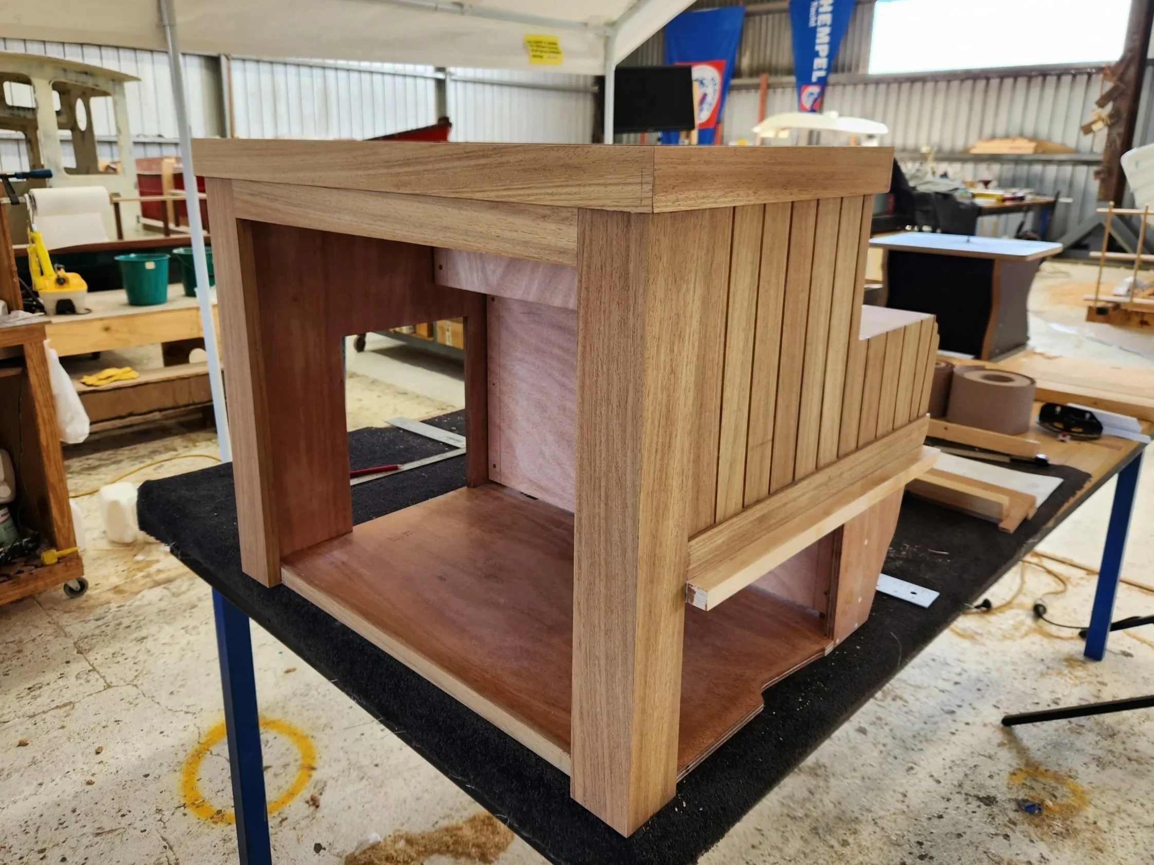 Marine plywood and teak composite electrical cabinet.