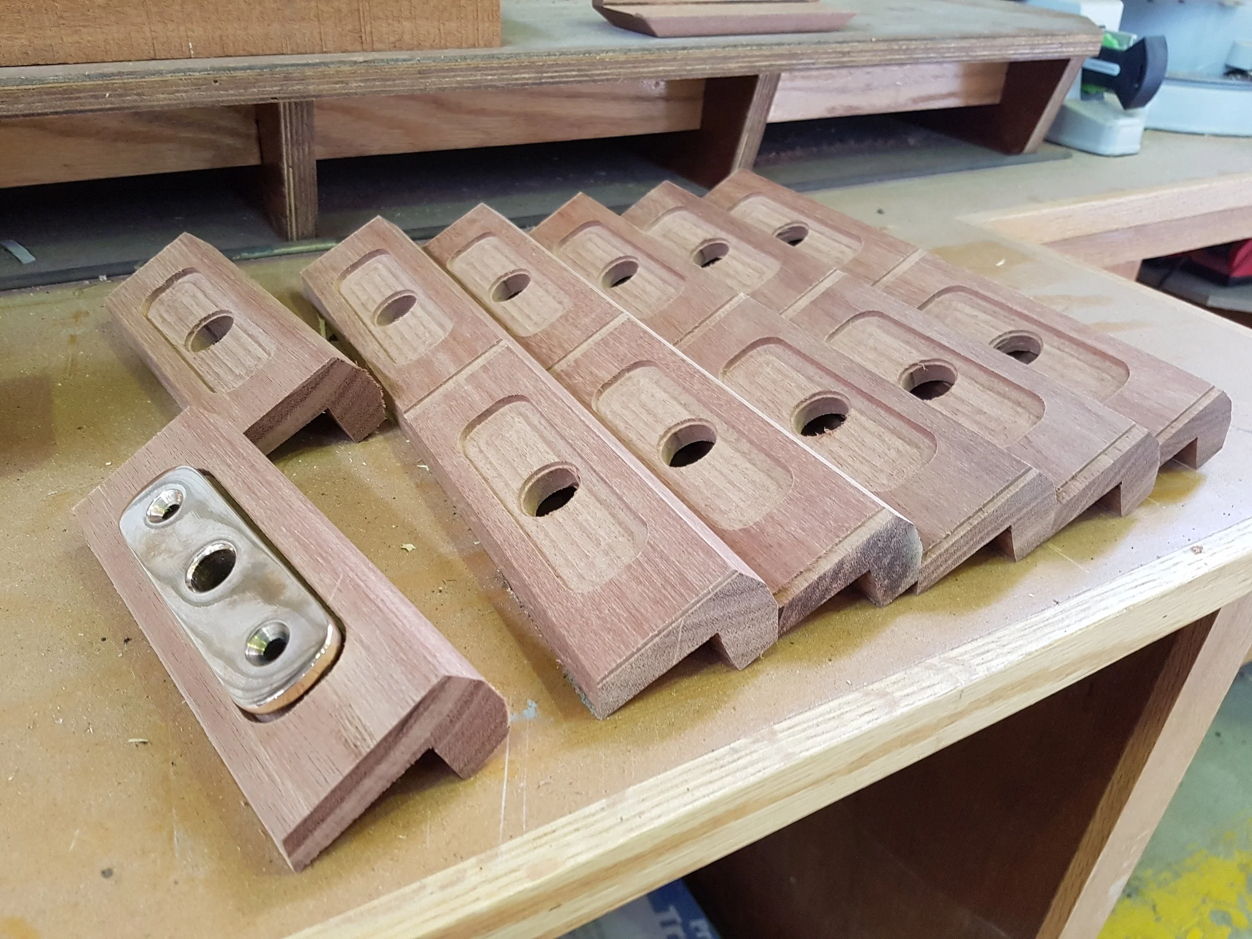 Custom bronze cast fitting mount blocks, milled from solid hardwood timber.