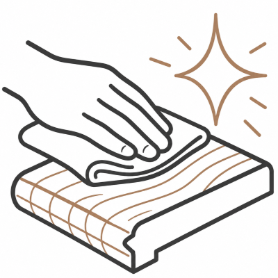 A hand polishing a wooden surface with a cloth, shining with sparkles.