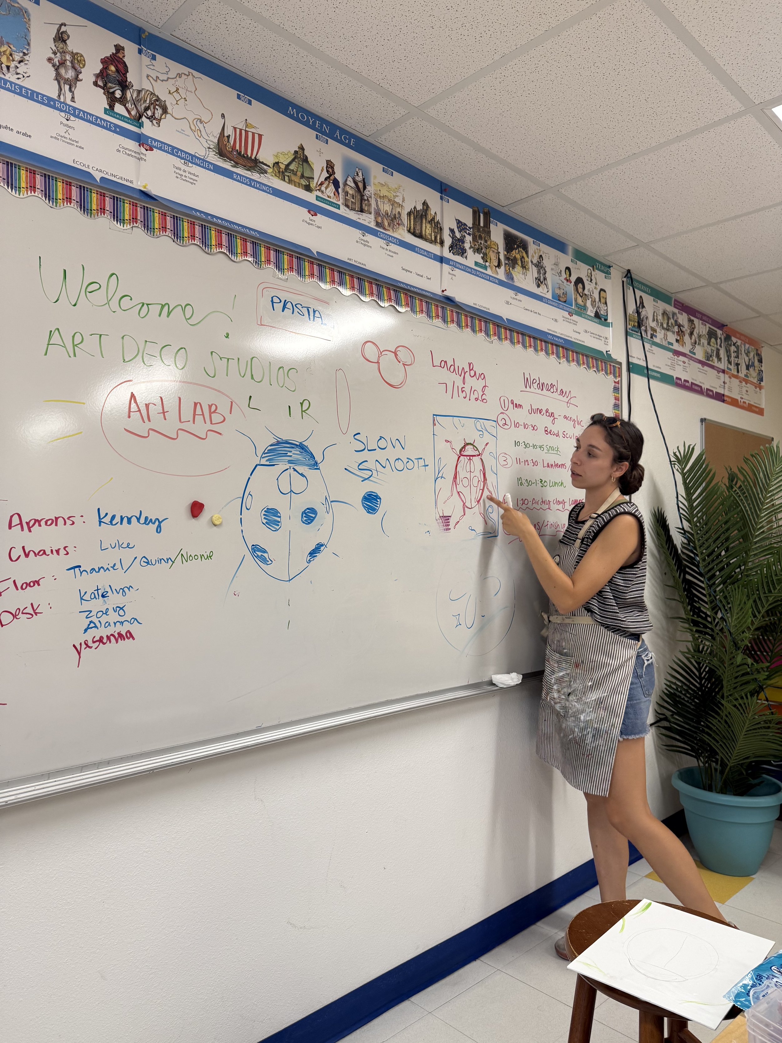 Ms. Sarah teaching a drawing lesson