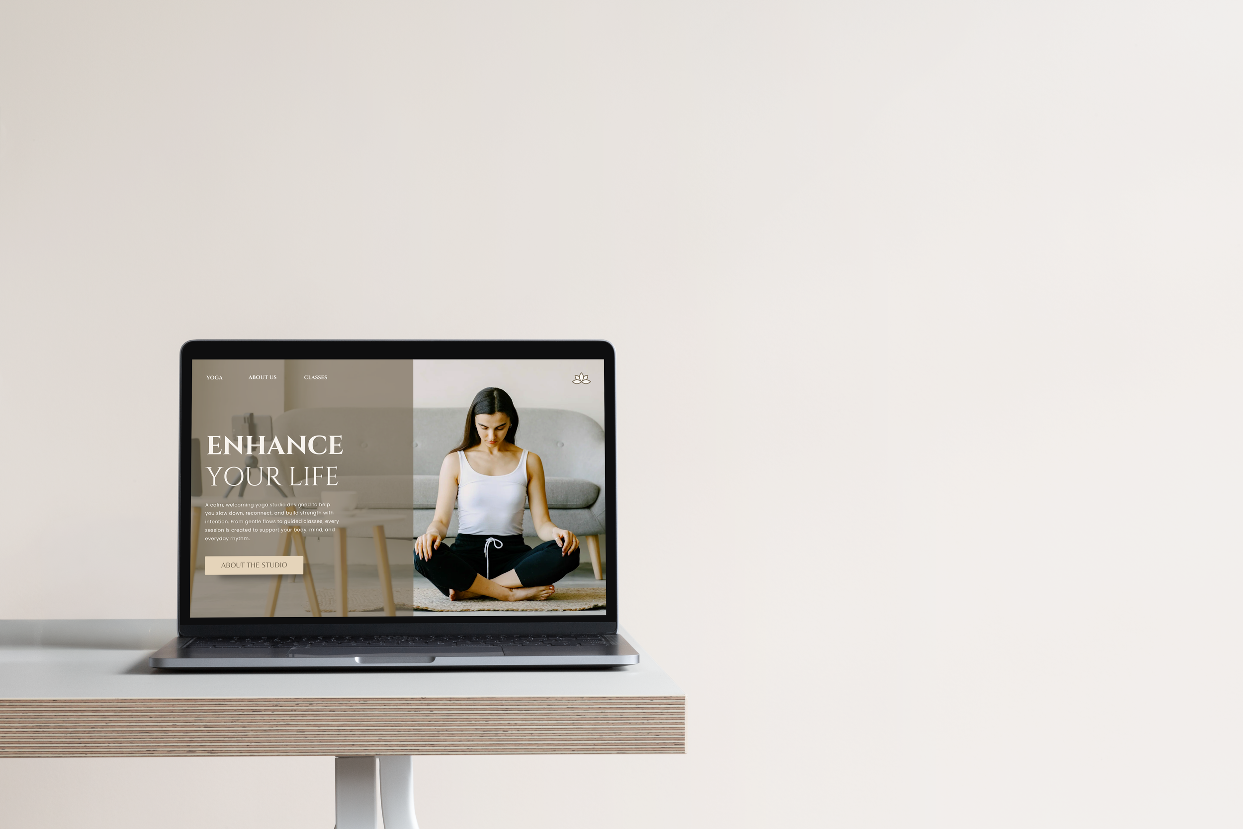 Laptop displaying a yoga business Squarespace website on a modern desk setup