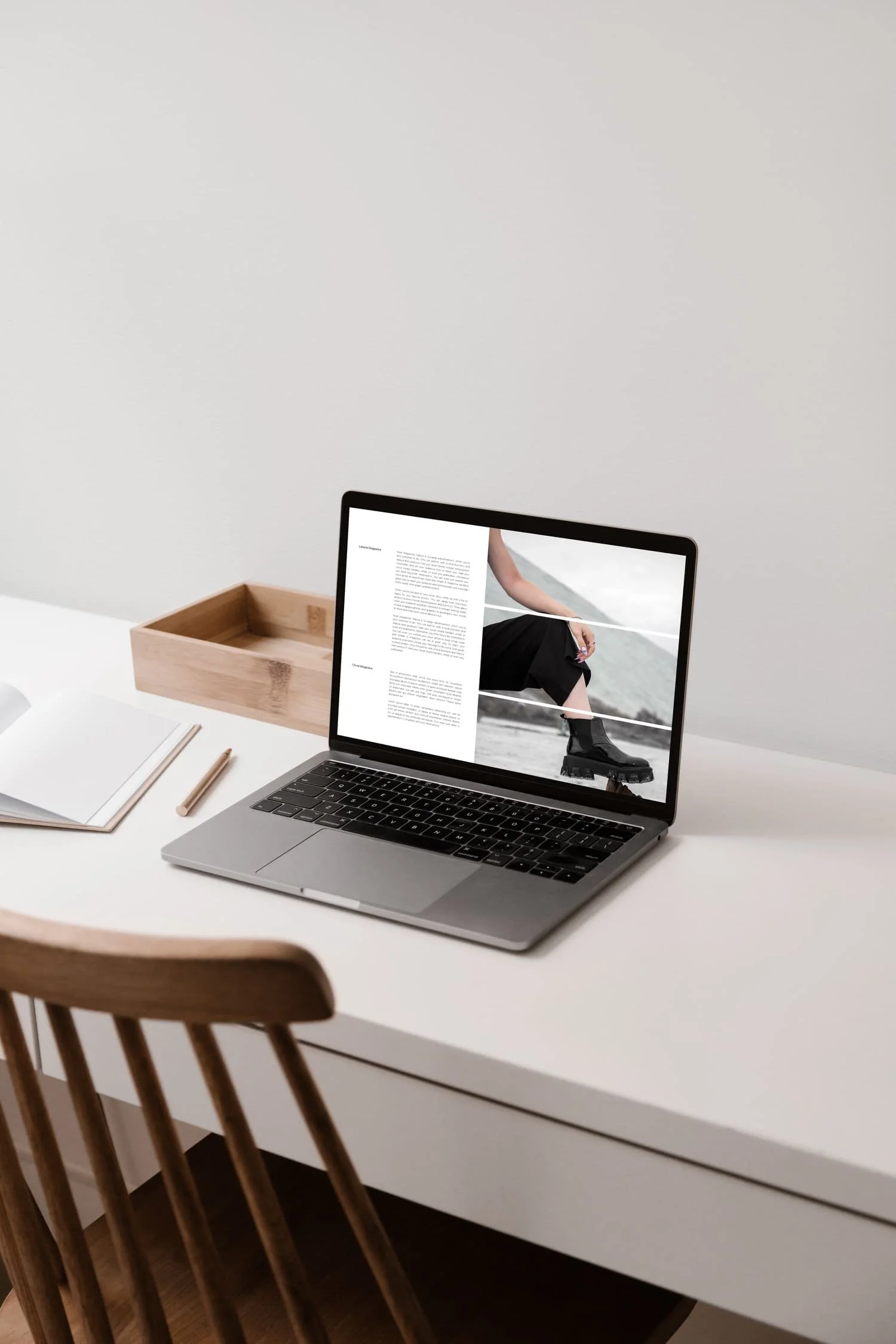 Laptop displaying a modern Squarespace website on a clean desk workspace