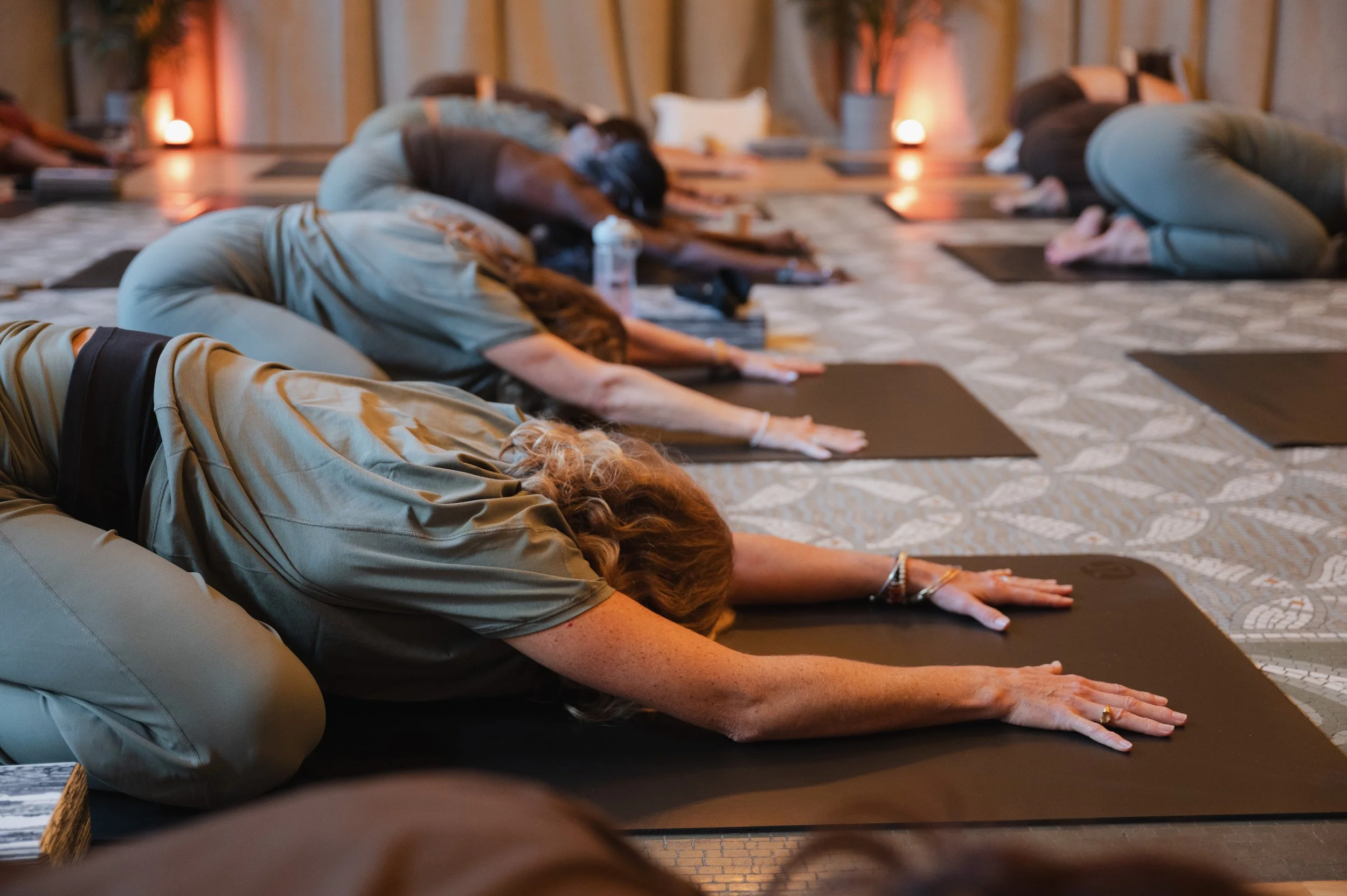 People lying on mats with therapy balls during The Cooldown, a recovery class in North Vancouver